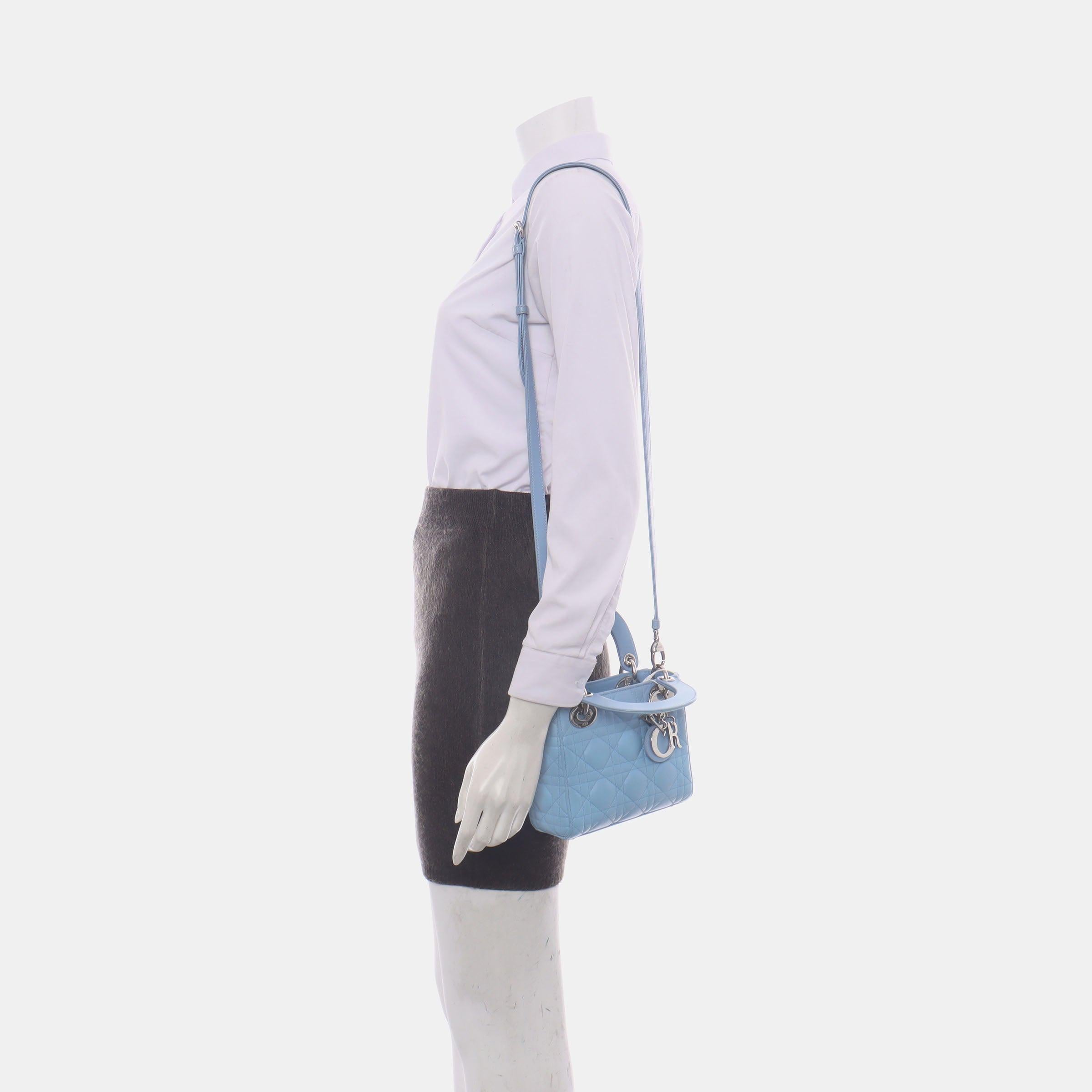 Lady Dior Mini Blue Cannage Lambskin Silver Hardware Crossbody Handbag
These are professional photos of the actual bag.

This classic bag features a cannage stitch, creating a beautiful silhouette and an instantly recognizable quilted design. It is