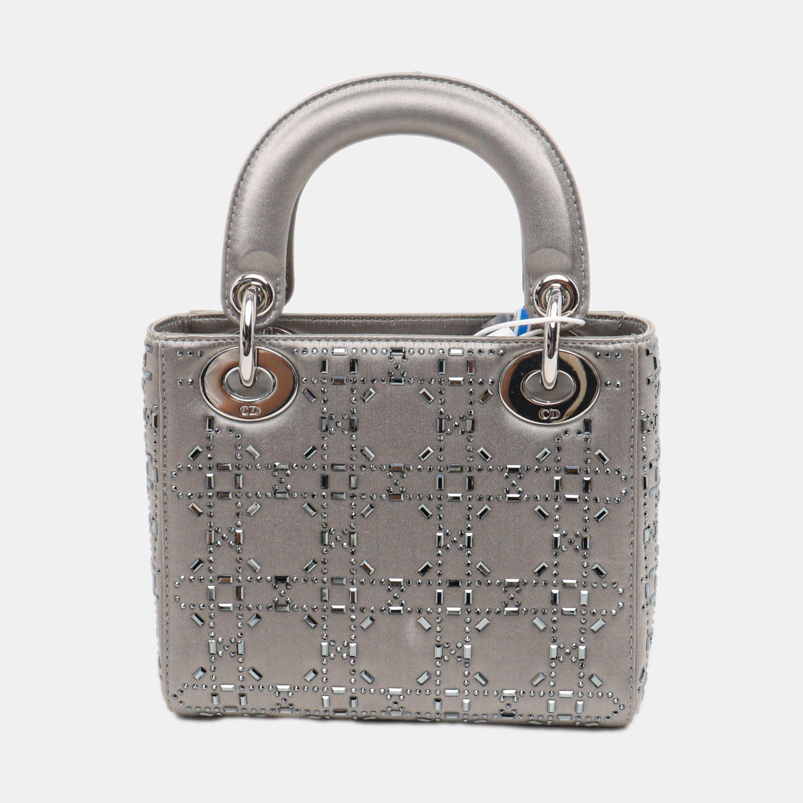 Lady Dior Mini Grey Silk with Crystals Silver Hardware
 These are professional photos of the actual bag.
 This mini handbag, made of high-quality black cloth with iconic micro-cannage stitching, is a stylish and elegant accessory for your wardrobe.
