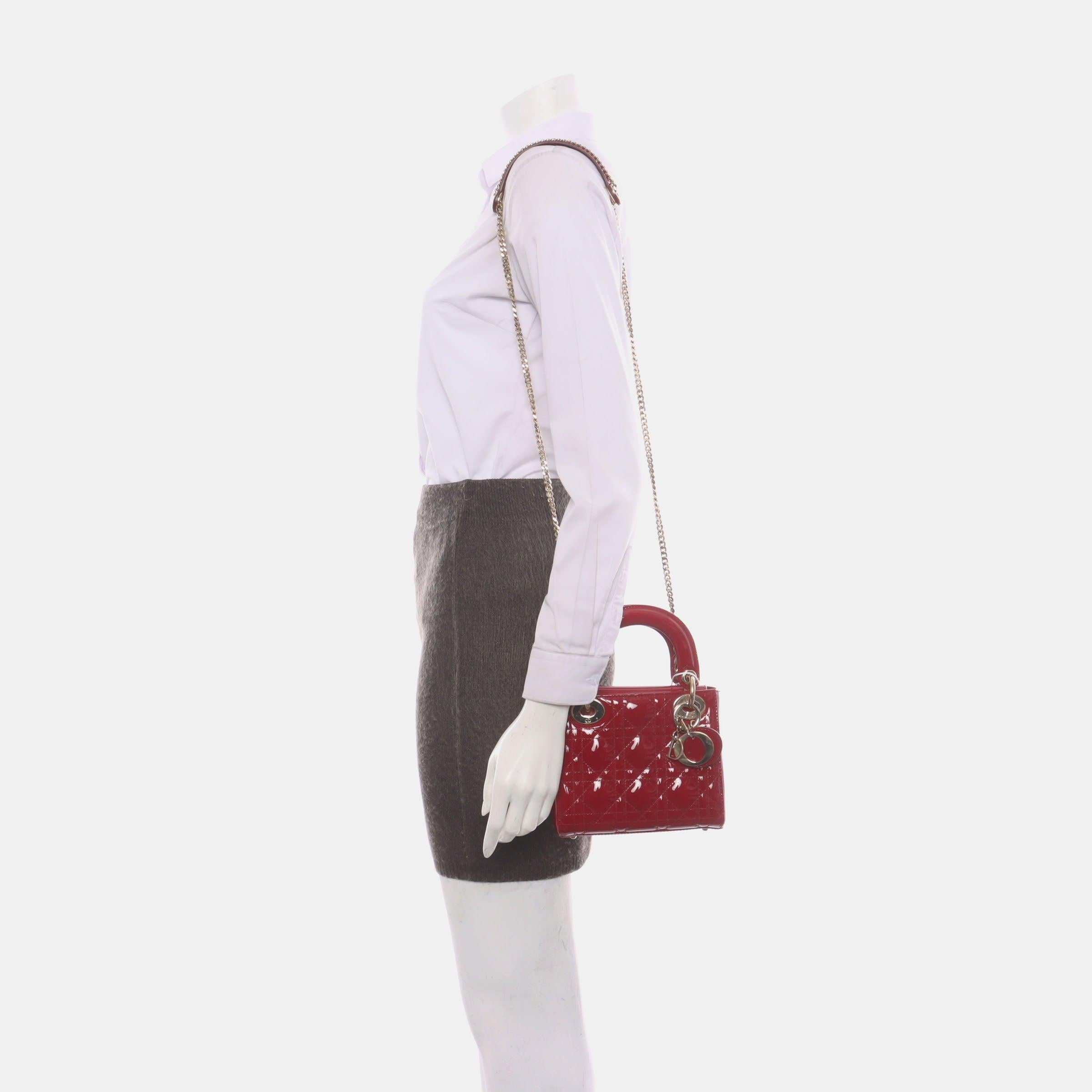 Lady Dior Mini Handbag Burgundy Red Patent Leather Gold-tone Chain Strap
 These are professional photos of the actual bag.
 This Lady Dior Mini handbag features a stunning red color in patent leather decorated with gold hardware, gold embellished