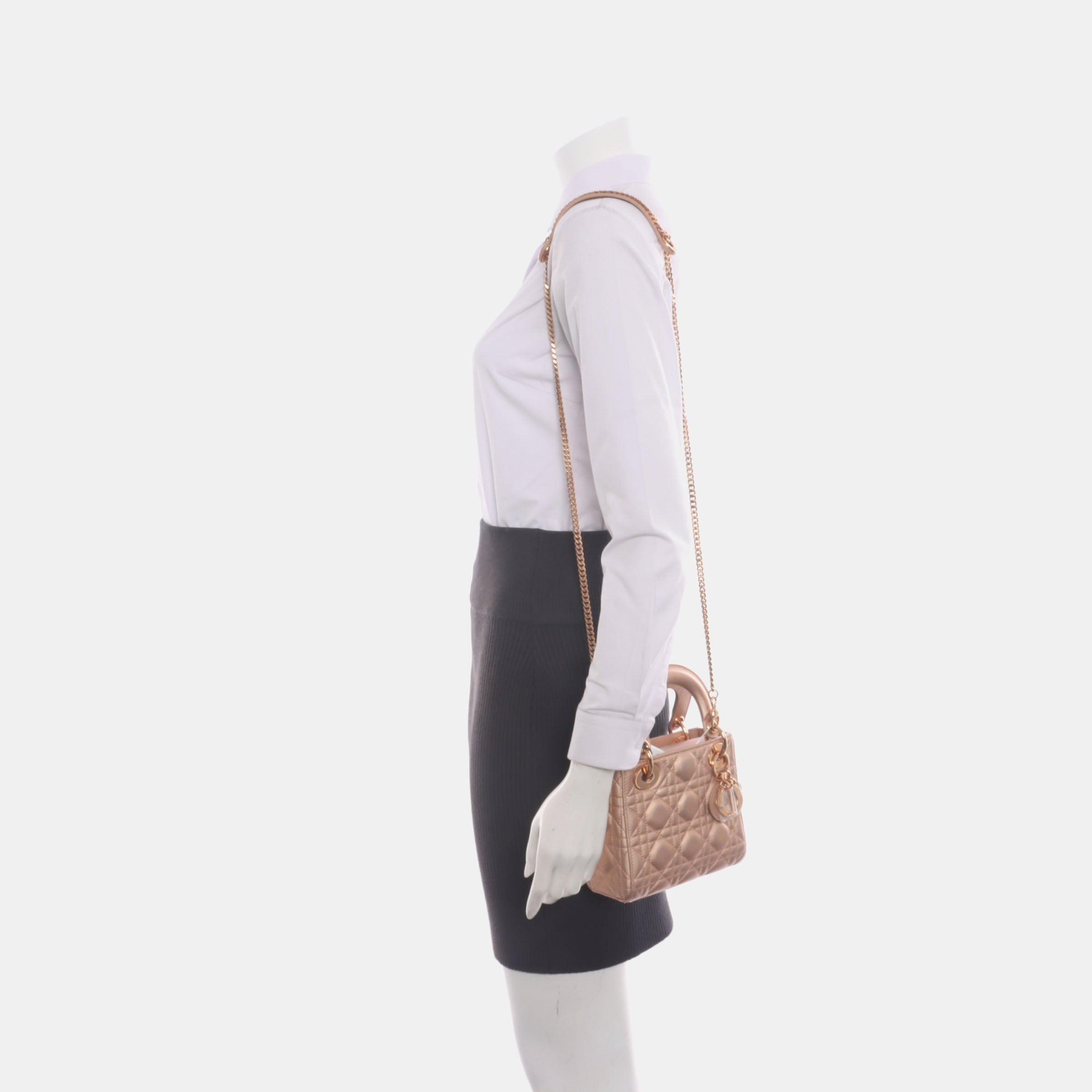 Lady Dior Mini Pink Irediscent and Metallic Cannage Lambskin Handbag
These are professional photos of the actual bag.

This classic bag features a cannage stitch, creating a beautiful silhouette and an instantly recognizable quilted design. It is