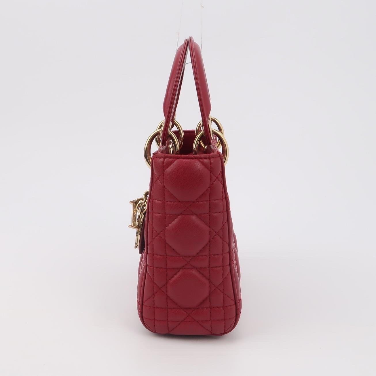 Lady Dior Mini Red Lambskin Leather Gold HW Chain Strap

 CONDITION: VERY GOOD CONDITION
 This preloved handbag is in very good condition with light signs of wear. There may be some scratches to the hardware. 
 DETAILS
 
 Brand: Christian Dior
