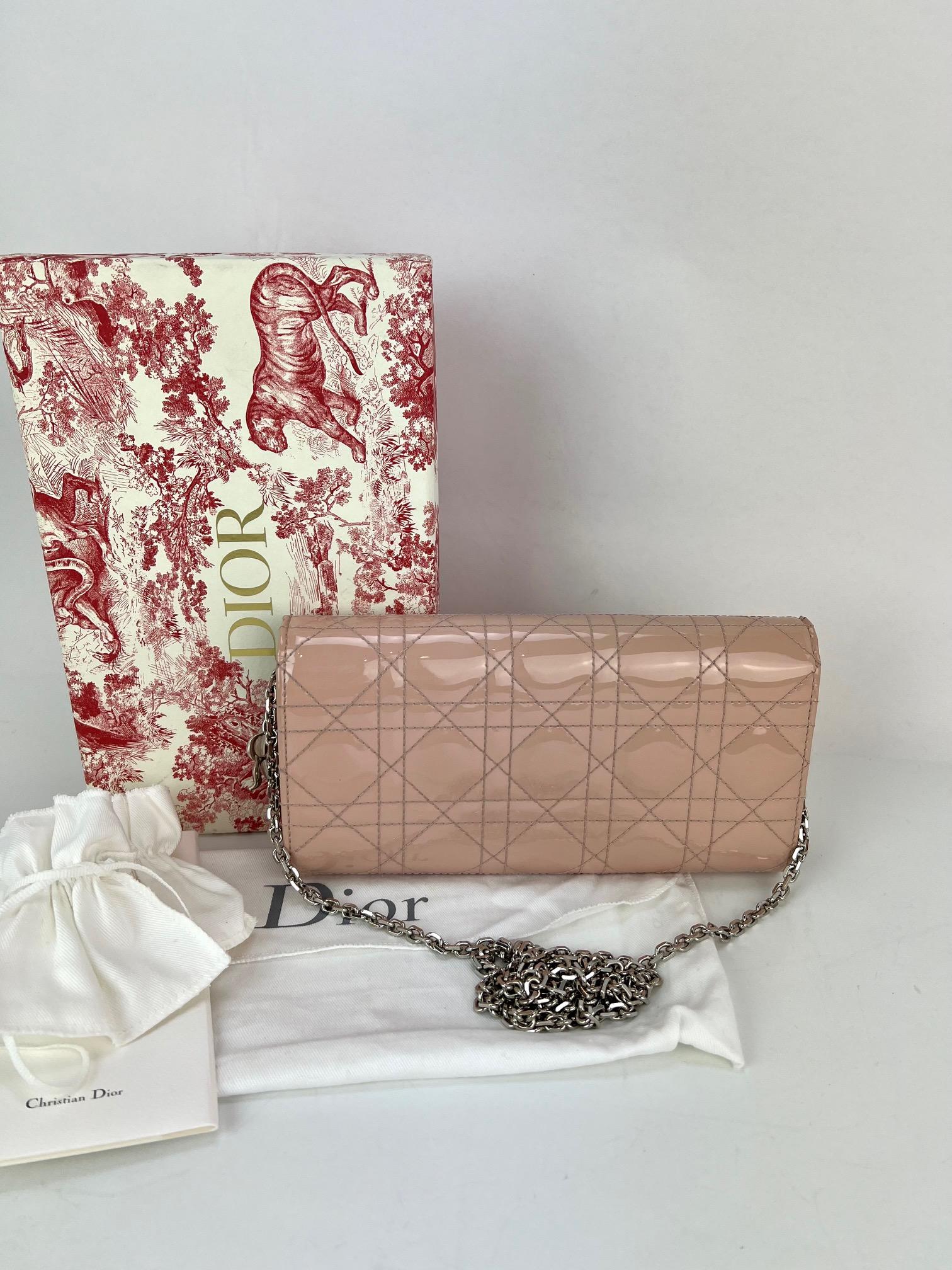 Pre-Owned  100% Authentic
Lady Dior Pouch Pink Patent Leather Cannage Wallet on a Chain Clutch 
RATING: A/B...Very Good, well maintained, 
shows minor signs of wear
MATERIAL: patent leather, calfskin
STRAP: Dior removable silver chain 48''
