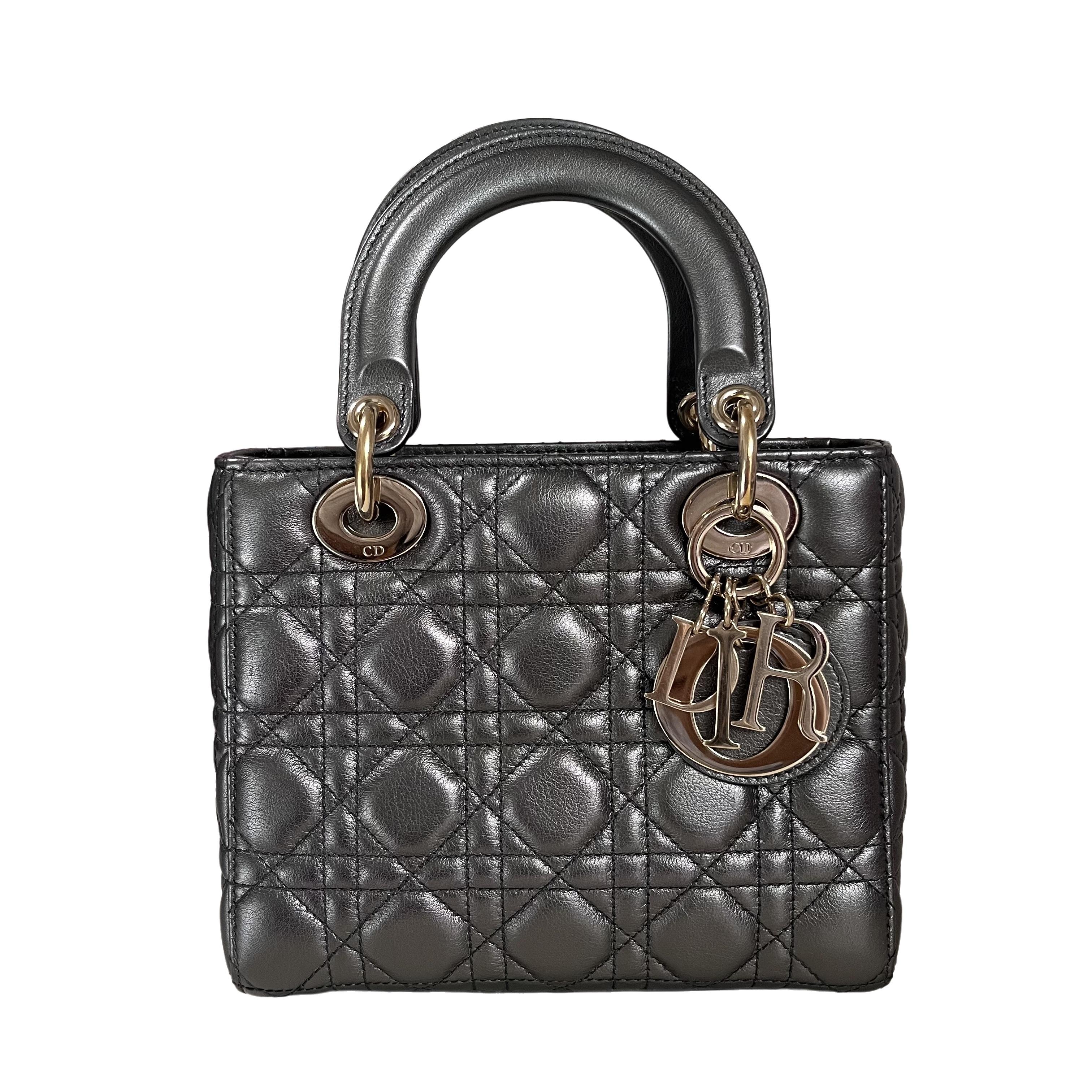 This ABCdior beauty in gunmetal grey color epitomizes elegance and beauty. Its popular size and cool color make it a must-have accessory for every stylish woman. Its removable shoulder strap, customized with your initials, allows for versatile wear