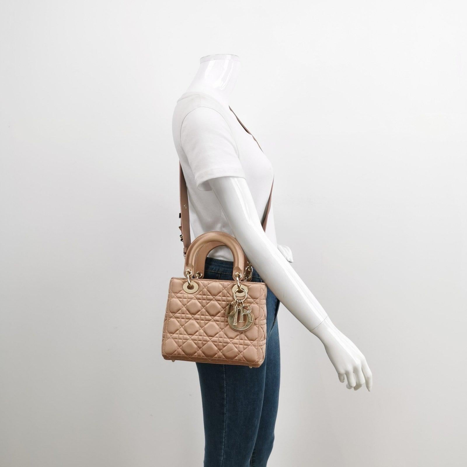 Lady Dior Small My AbcDior 2019 Beige Silk Handbag Crystal Charms
  These are professional photos of the actual bag.
  This small Lady Dior handbag, made of high-quality silk, adored with crystal embellished charms, is a stylish and elegant
