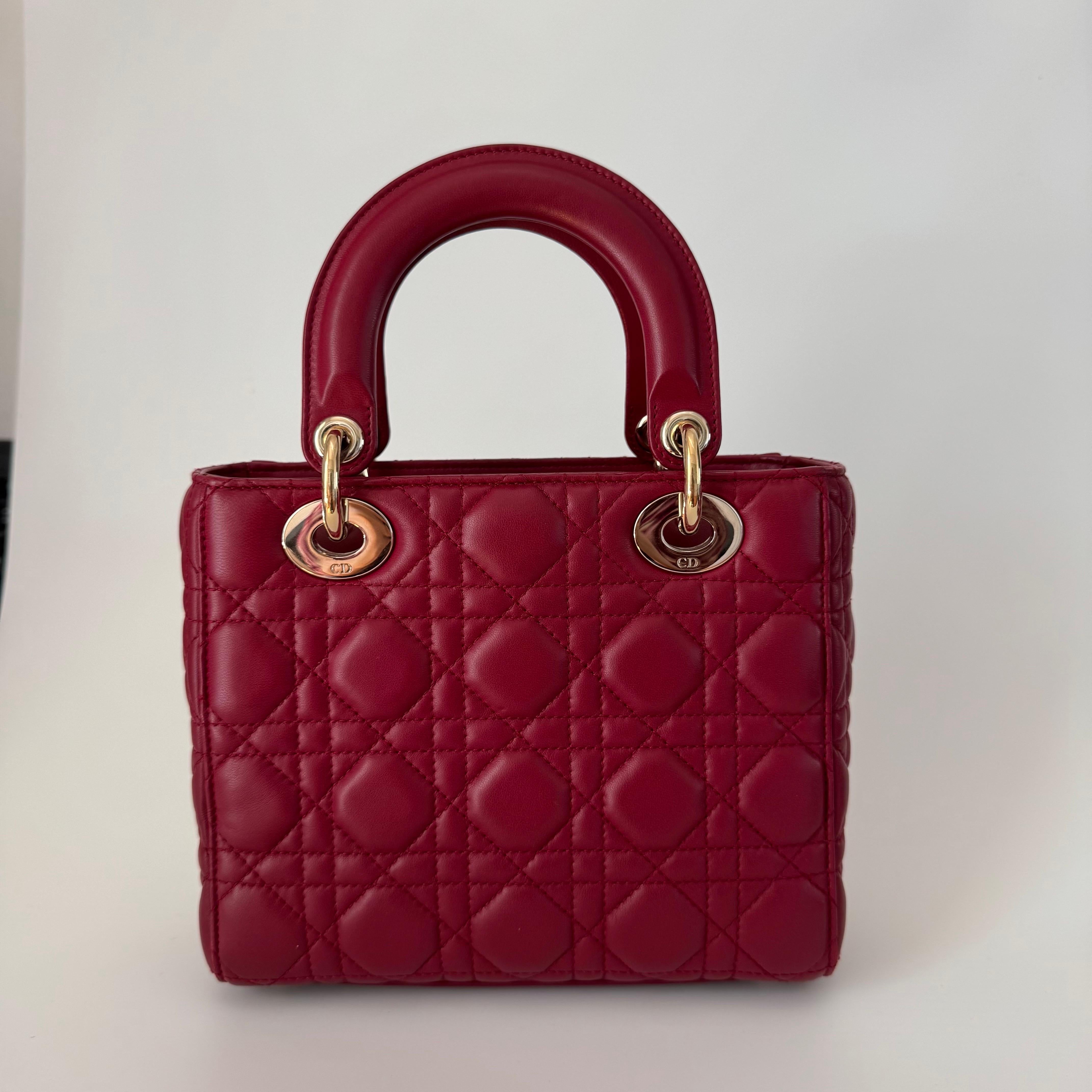 Accentuate your look with the timeless style of Small Lady Dior My Abcdior, crafted in Burnt Orange Lambskin Leather. This classic bag features a cannage stitch, creating a beautiful silhouette and an instantly recognizable quilted design. It is