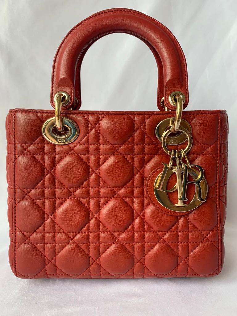 These are the professional photos of the actual bag offered by Luxbags

The Lady Dior bag is an epitome of elegance and beauty. Accentuate your look with the timeless style of Small Lady Dior My Abcdior, crafted in Red Lambskin Leather. This classic