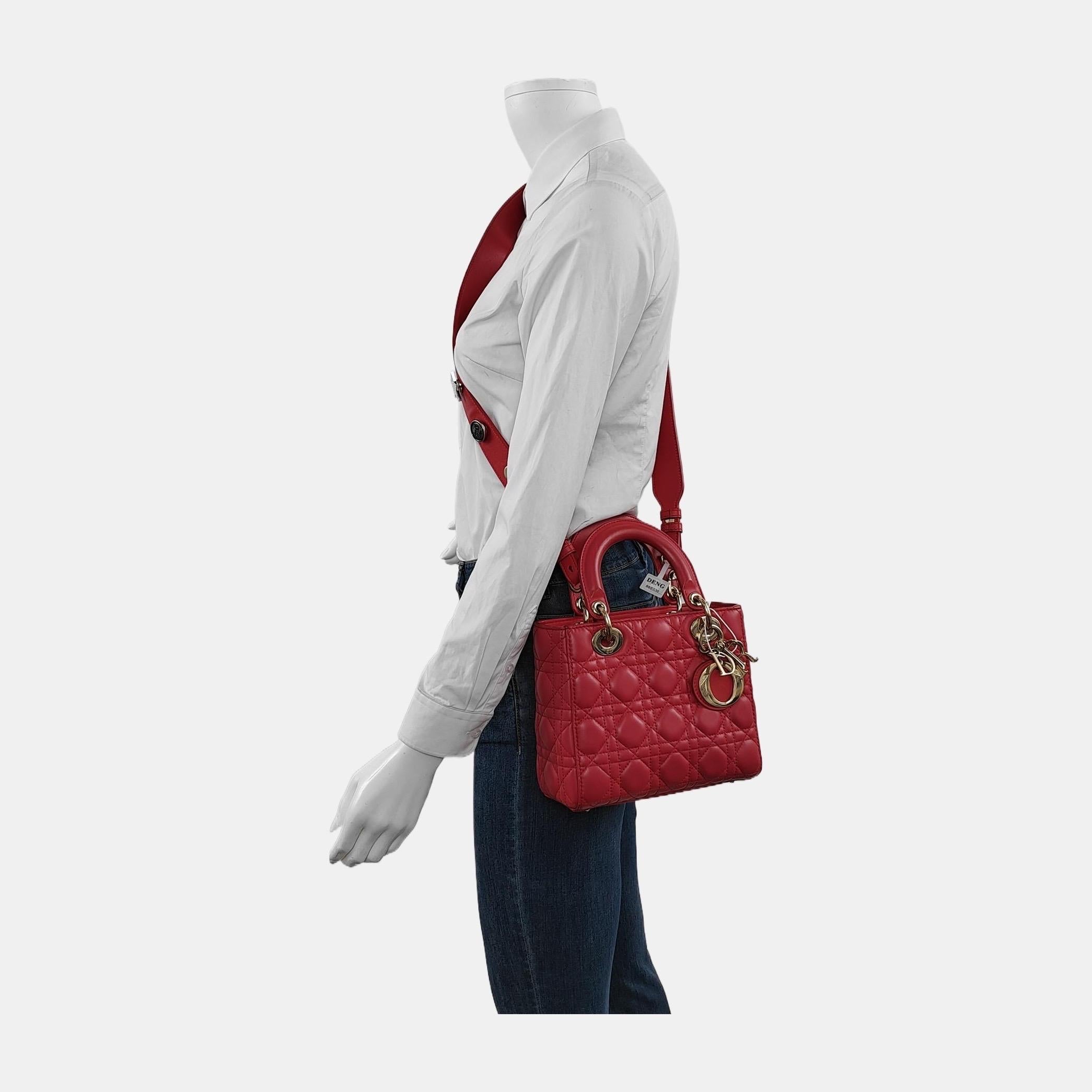Accentuate your look with the timeless style of Small Lady Dior My Abcdior, crafted in Burnt Orange Lambskin Leather. This classic bag features a cannage stitch, creating a beautiful silhouette and an instantly recognizable quilted design. It is