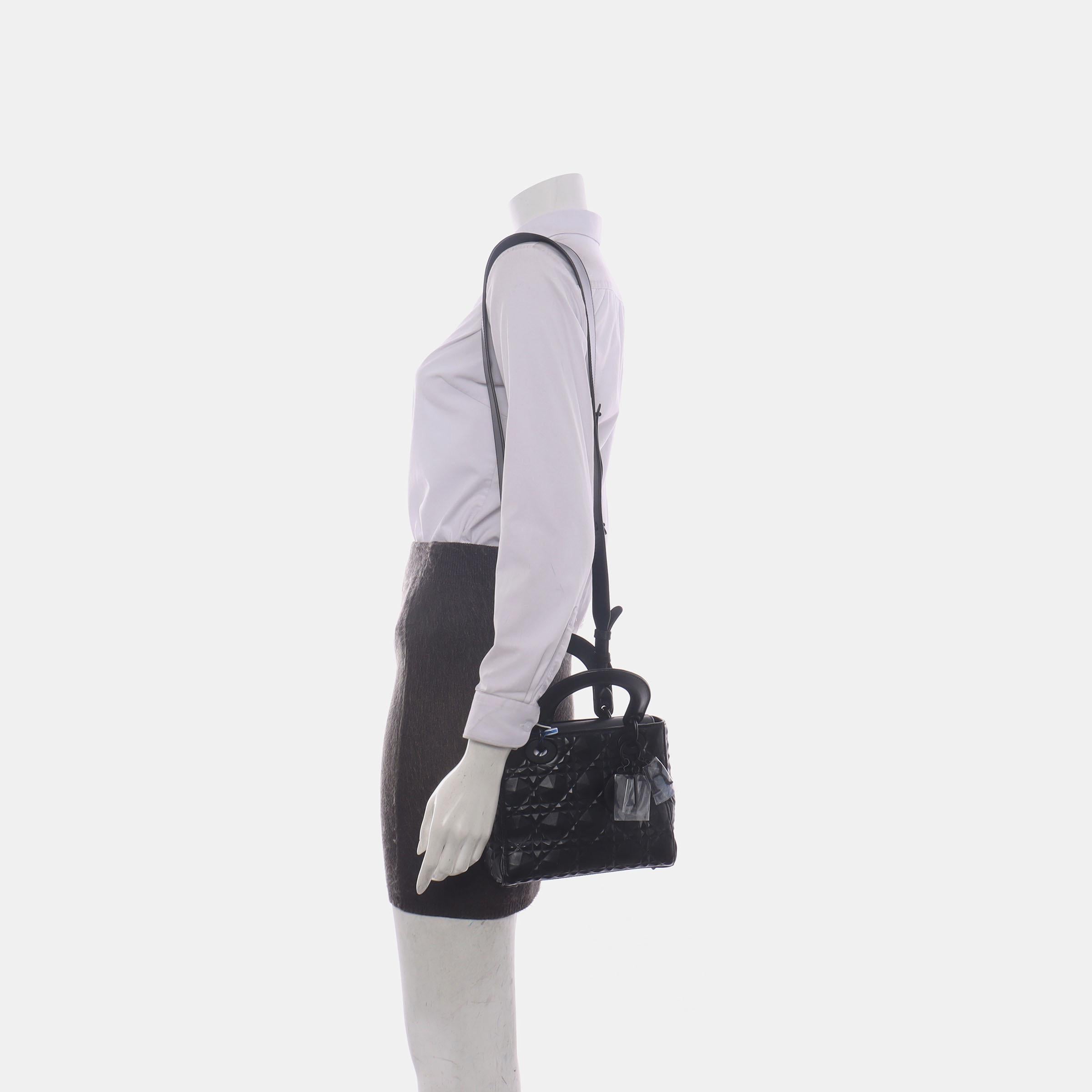 The Lady Dior bag is an epitome of elegance and beauty. Accentuate your look with the timeless style of Small Lady Dior My Abcdior, crafted in Cream White Lambskin Leather. This classic bag features a cannage stitch, creating a beautiful silhouette