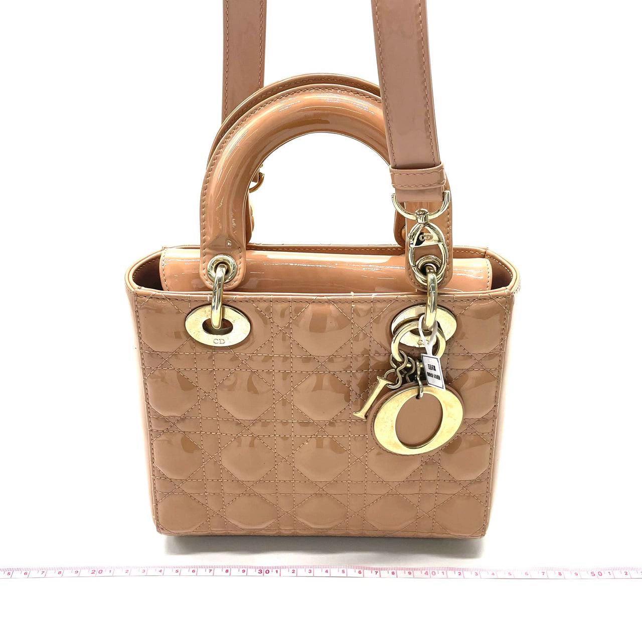 Lady Dior Small Nude Beige Patent Leather with Strap
  These are professional photos of the actual bag.
  
  Introducing the Lady Dior Small ABCdior Grey Patent Leather Handbag.
  Its ABCdior my lady dior design and grey patent leather make it the