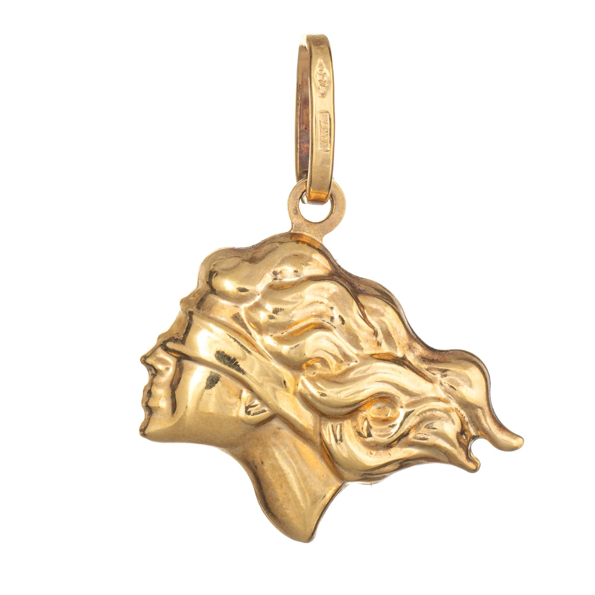 Finely detailed Lady Justice blindfolded charm (or pendant) crafted in 18k yellow gold.  

The nicely detailed charm is small in scale and features a blindfolded Lady Justice. The charm is hollow and has a lightweight feel. The piece can be worn on