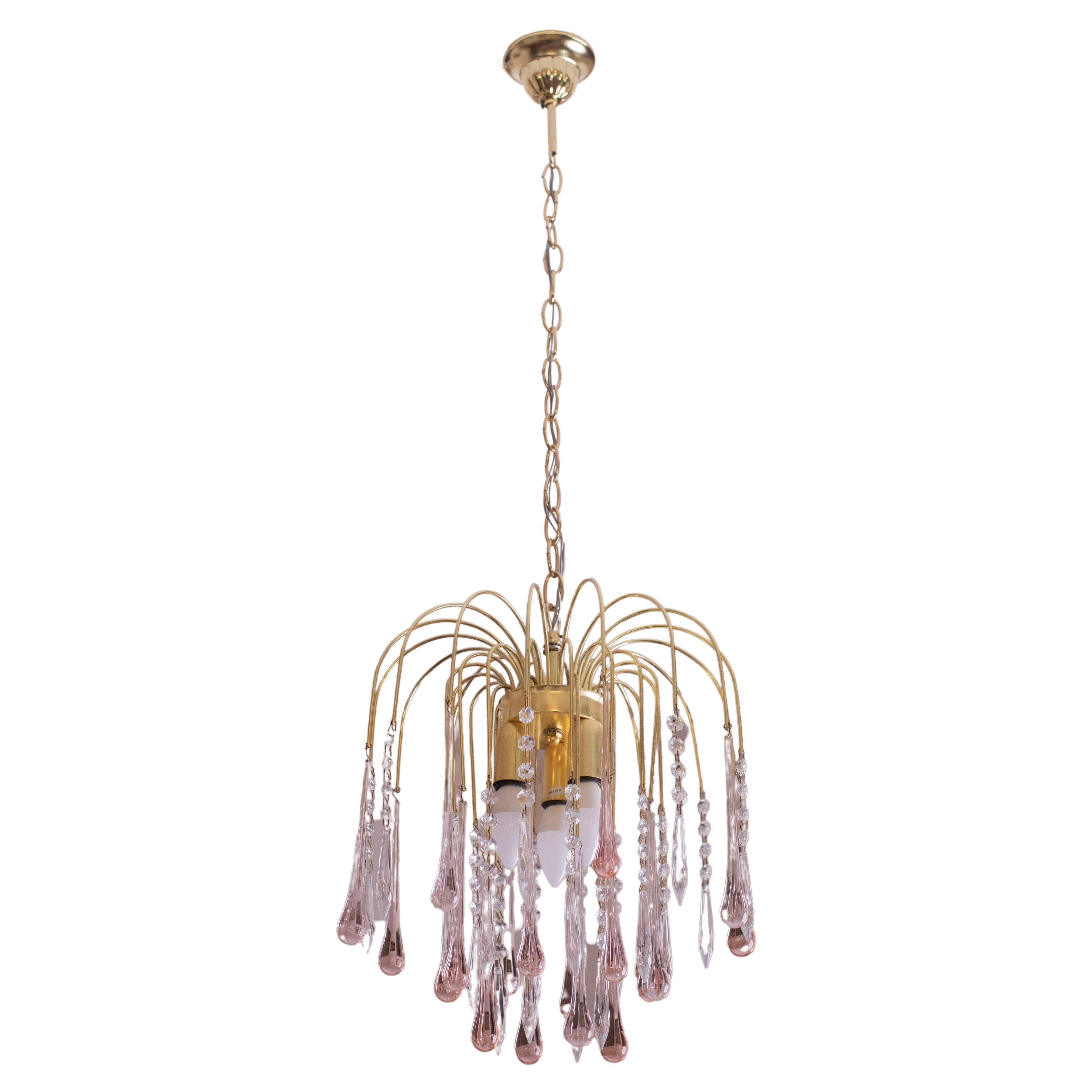 Gorgeous Murano chandelier in the style of Venini La Cascata.
The frames are in perfect aesthetic condition.
The chandeliers consist of three rounds composed of beautiful pink drops cascading down and alternating with crystals.
The chandelier