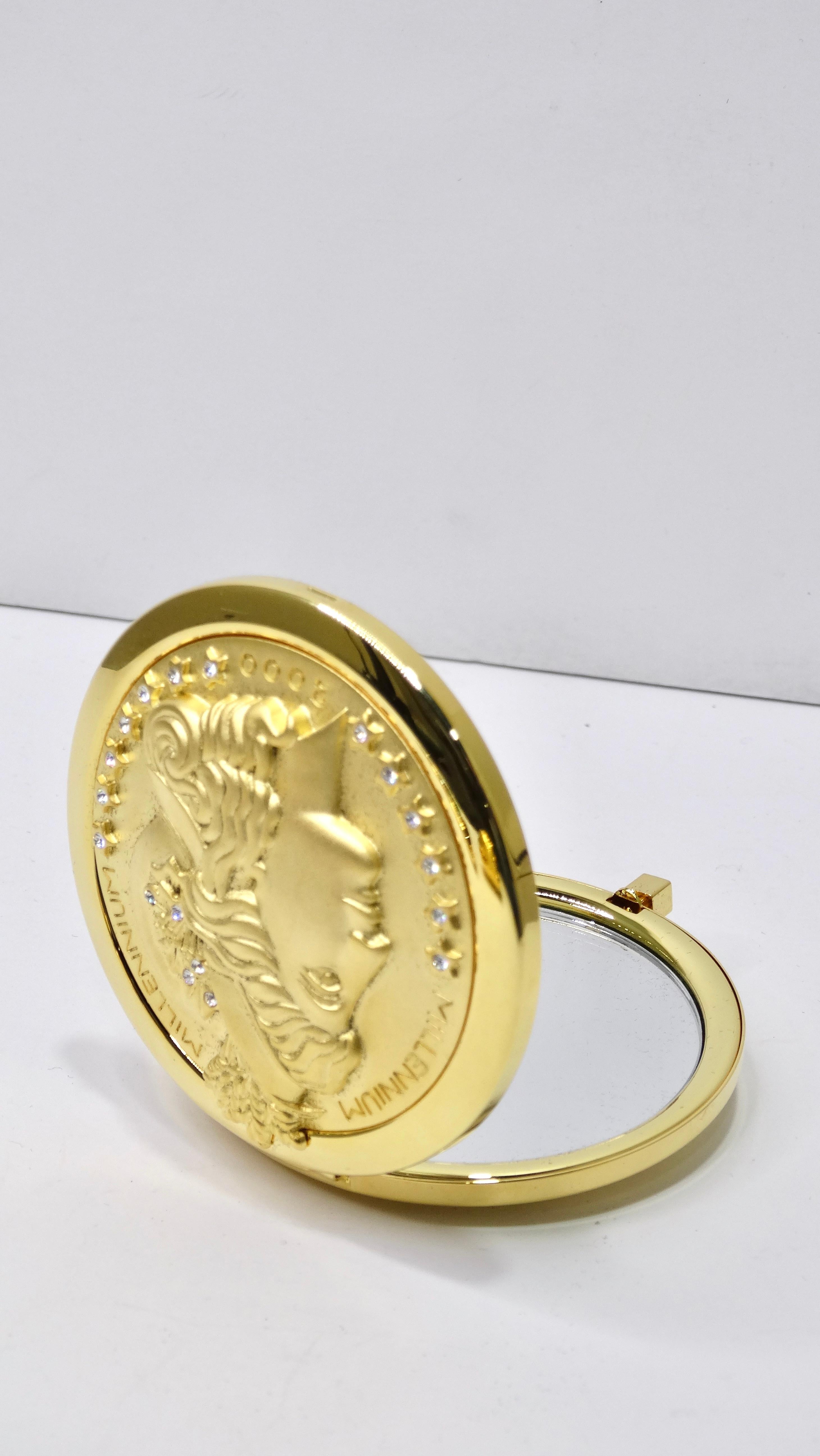 This is a highly sought after accessory! Nothing is more luxurious than this gold coin shaped compact encrusted in crystals. Touch up your makeup in style with this exquisite find. This is a beautifully crafted vintage Lady Liberty millennium coin