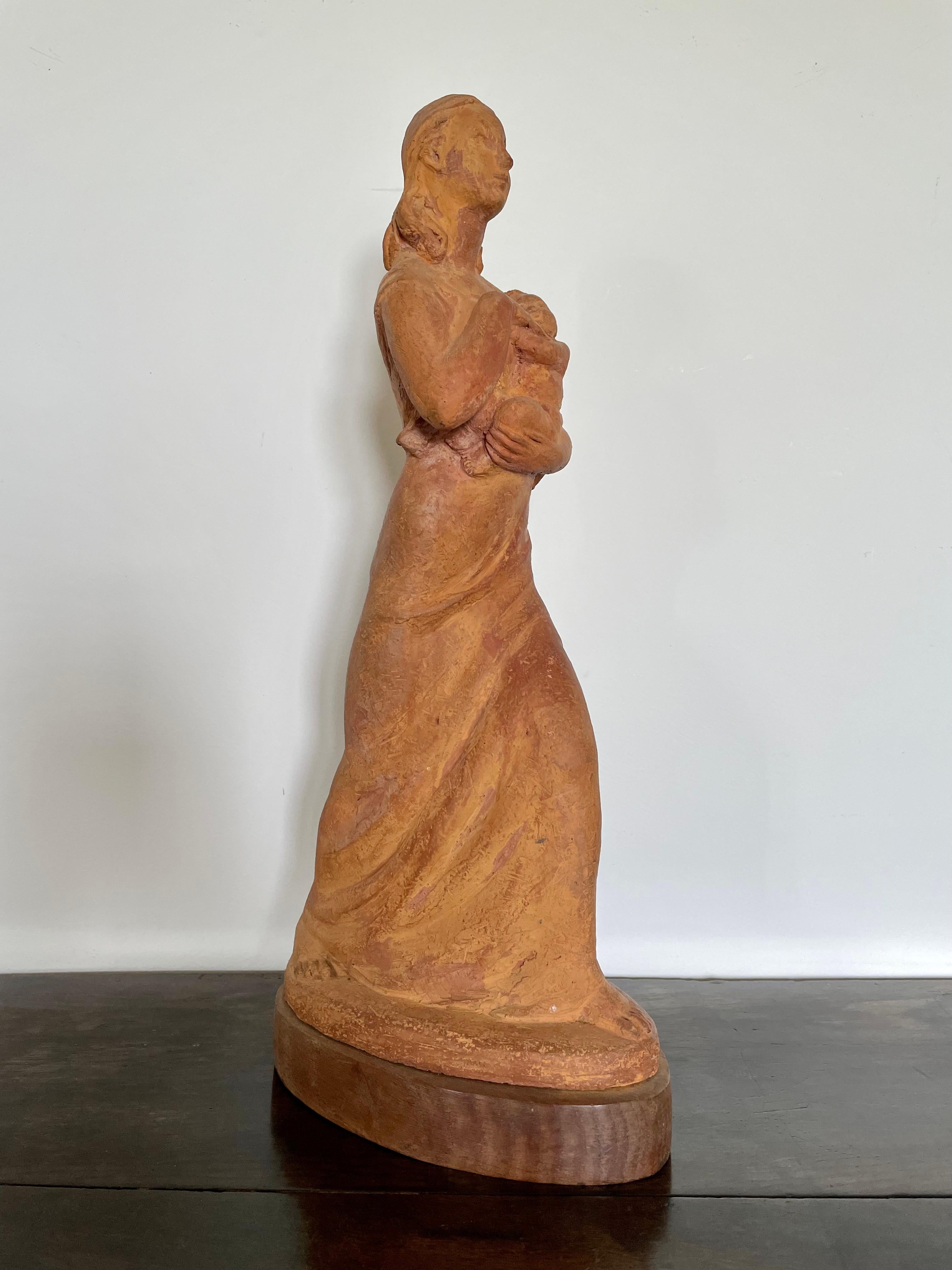 LADY MURIEL WHEELER, PSWA
(1888-1979)

Mother and Baby

Signed and indistinctly dated 19-4
Terracotta on wooden base

44 cm., 17 ¼ in. high including base

Muriel Bourne was born in Shrewsbury and studied at Wolverhampton School of Art.  In 1918 she
