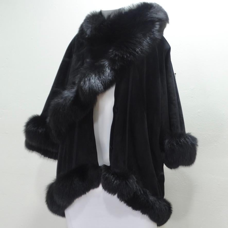 Do not miss out on this absolutely show-stopping Lady Napoleon black fur cape! The most unique winter accessory is calling your name! Black suede? accompanies fur detailing to create a classic and versatile coat. The wrap-around cape motif coming