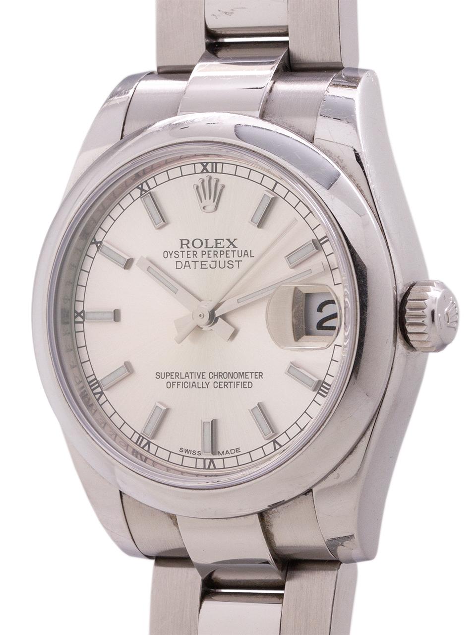 
Man/s midsize Rolex stainless steel Datejust ref# 178240 circa 2015 complete with box and papers. Featuring  31mm diameter midsize case with smooth domed bezel and sapphire crystal, original silver dial with new style wide luminous stick indexes.