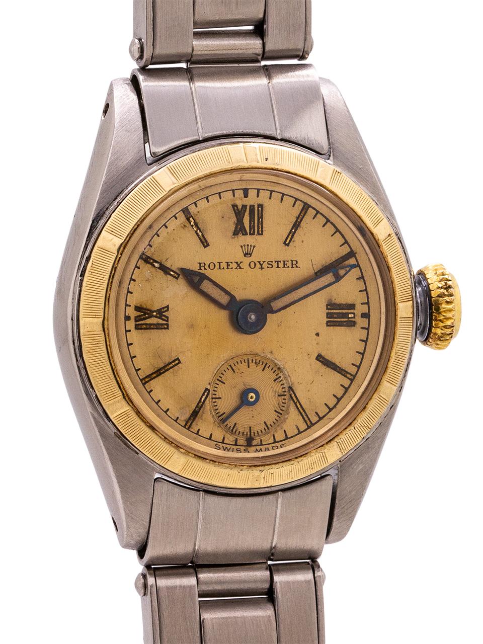 
Lady Rolex Oyster manual wind stainless steel and 14K ref 4437 circa 1958. Featuring a 27mm diameter Oyster case with yellow gold fluted bezel and screw down case back and original yellow gold period screw down crown. With very pleasing original