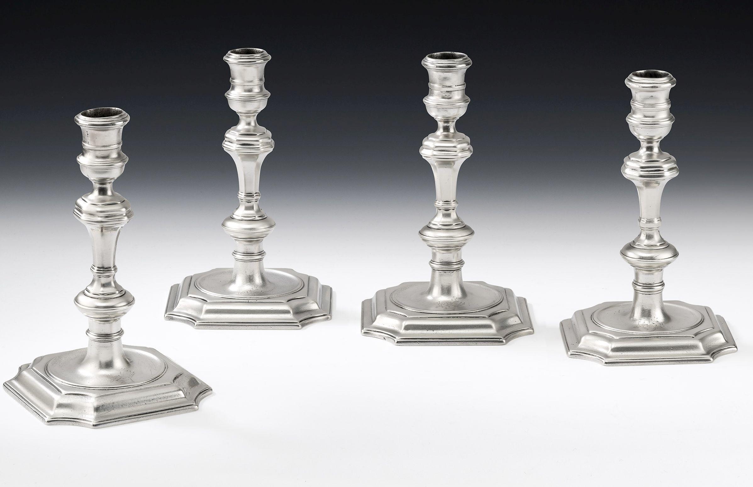 Lady Silversmiths. A very fine set of four GeorgeI/II Cast Candlesticks all made in London, one in 1722 by Srah Holaday and three in 1732 by Elizabeth Buteux. The Candlesticks are identical in design and stand on a stepped base with incuse corners.