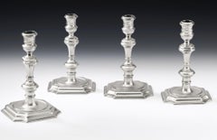 Lady Silversmiths, a Set of Four George I/II Candlesticks, London, 1722 & 1732