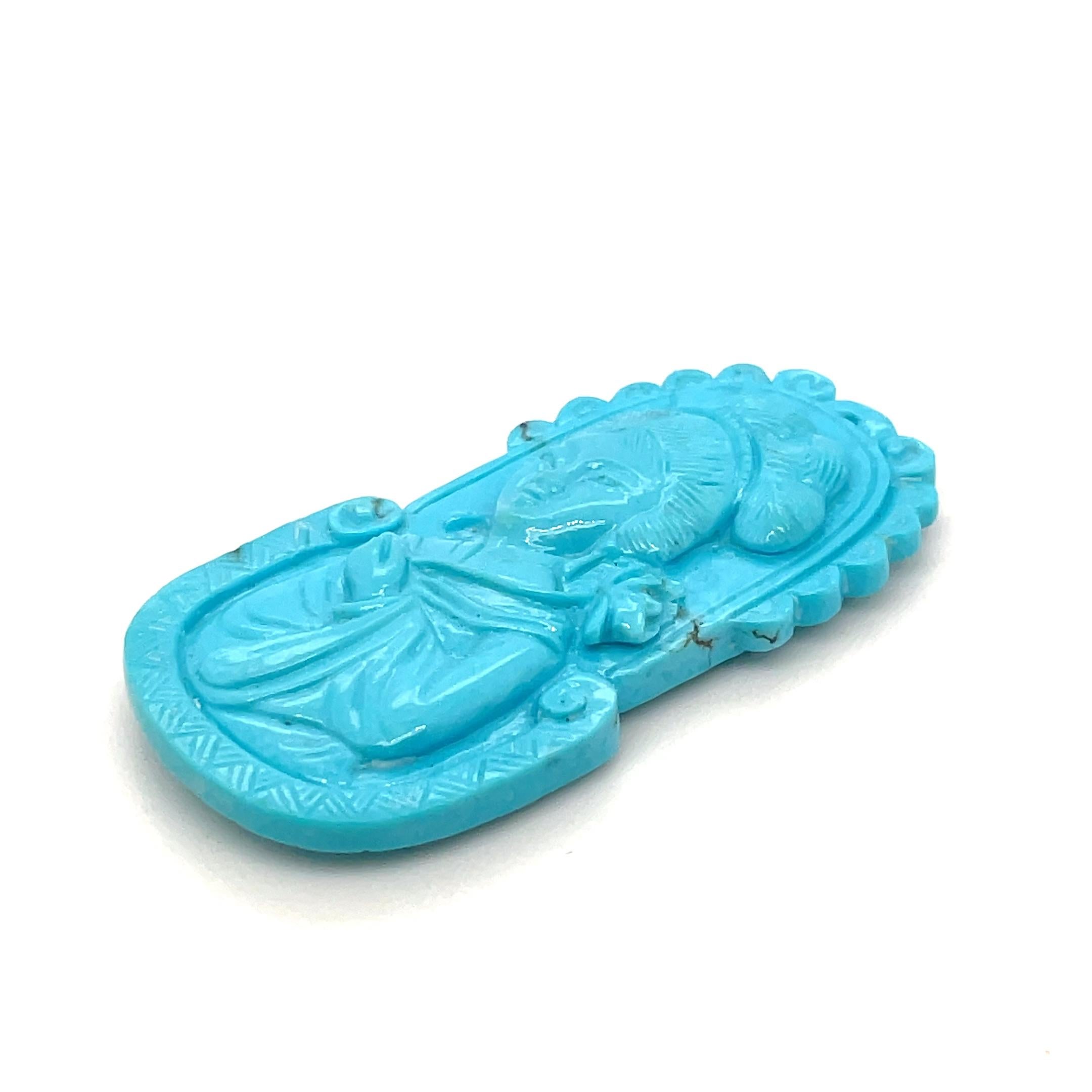 This 43.15-carat Turquoise pendant, intricately carved into a graceful lady’s figure, is a true masterpiece of craftsmanship. 

Sourced from Tibet, Turquoise is known as a stone of protection, wisdom, and good fortune, cherished for centuries for