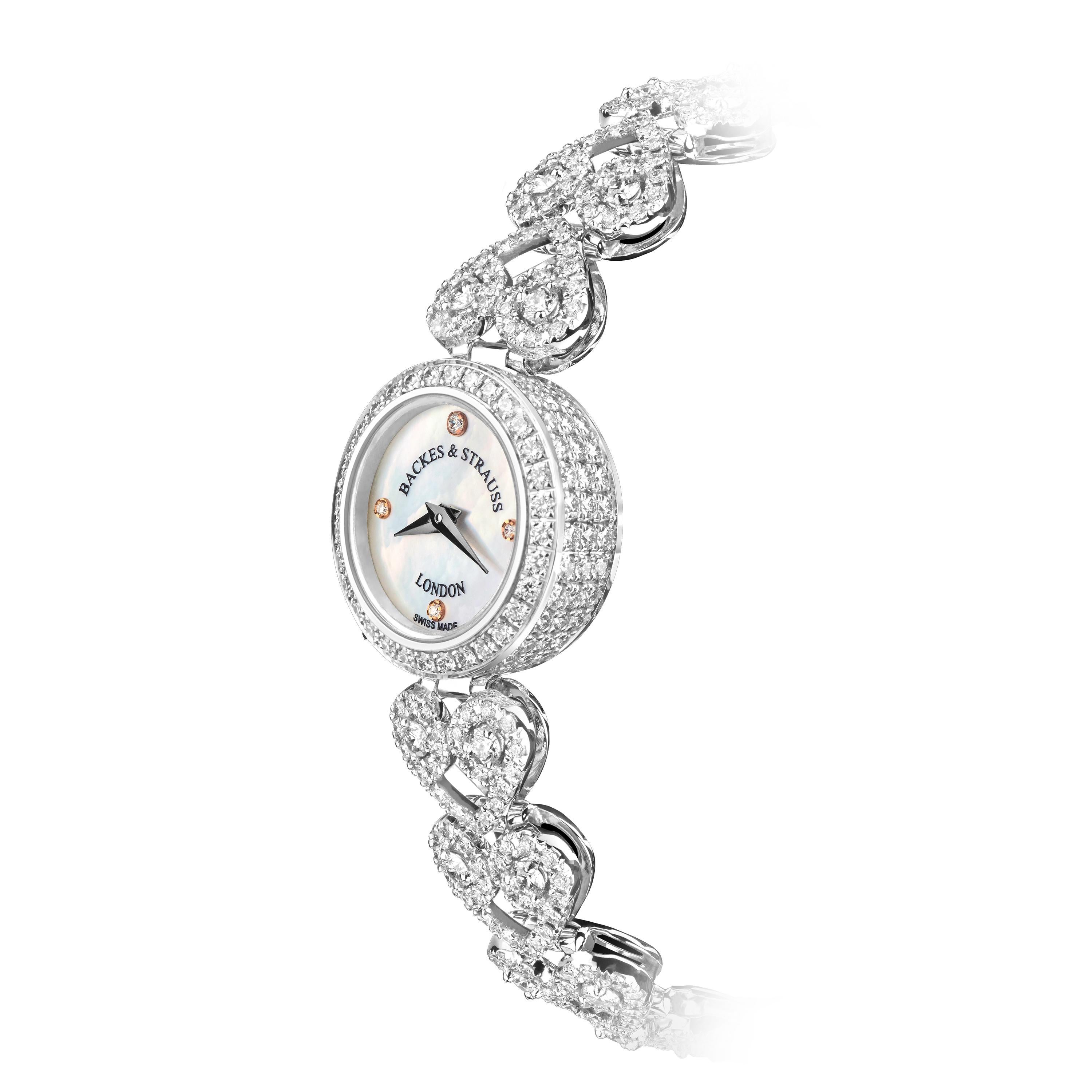 The Lady Victoria is a luxury diamond watch for women crafted in 18kt White gold, featuring the mother-of-pearl dial, quartz movement. The case, dial, bracelet and buckle are set with white Ideal Cut diamonds. It is a 18mm classy cocktail watch with