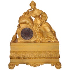 "Lady with Cushion" Gilt Bronze Clock, Early 19th Century