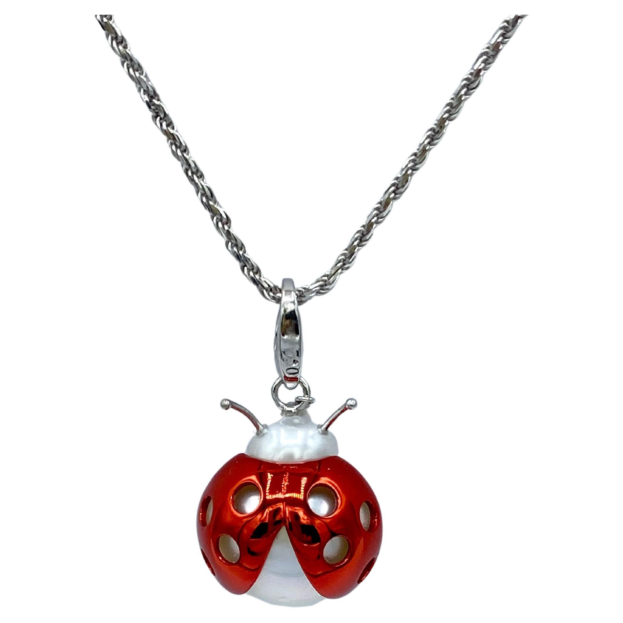 Ladybird/bug Australian Pearl Red White 18Kt Gold Pendant/Necklace or Charm
A very beautiful Australian pearl has been carefully crafted to make a ladybug, It is often used as a lucky charm. 
The ring for the necklace is a carabiner so it can be
