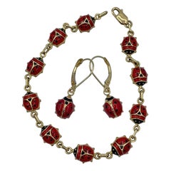 Bracelet et boucles d'oreilles coccinelle en or 14 carats et émail avec attache coccinelle