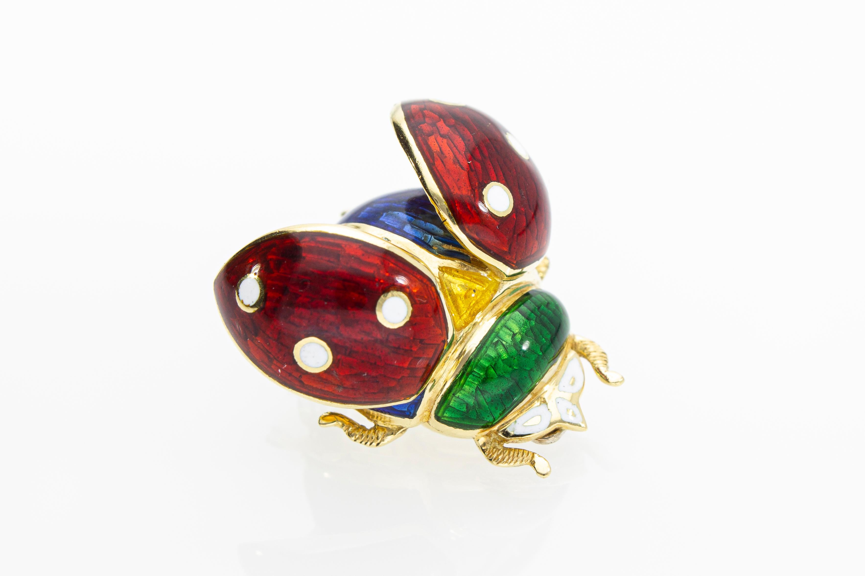 The pendant in the shape of a ladybug with open wings, can be worn both as a pendant and as a brooch. The ladybug is decorated with transparent enamels of various colors. 
Its manufacture is performed by a company of Italian craftsmanship