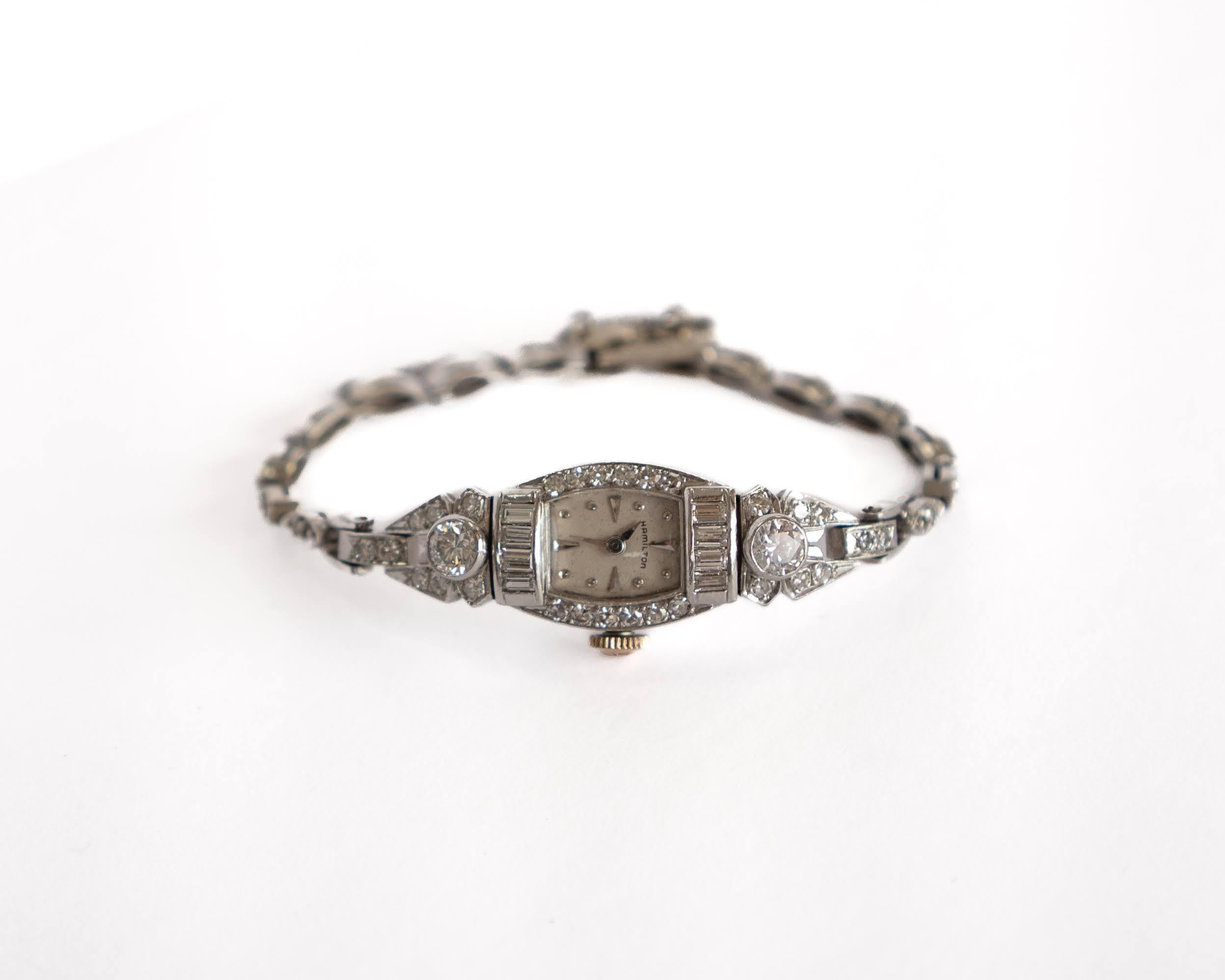 For a fancy night out, or a casual evening this watch is great for elegant touch to your appearance. This vintage 14K White gold watch and 14K white gold link-style bracelet has 2 round bezel settings, 8 rectangular channel settings, and 41