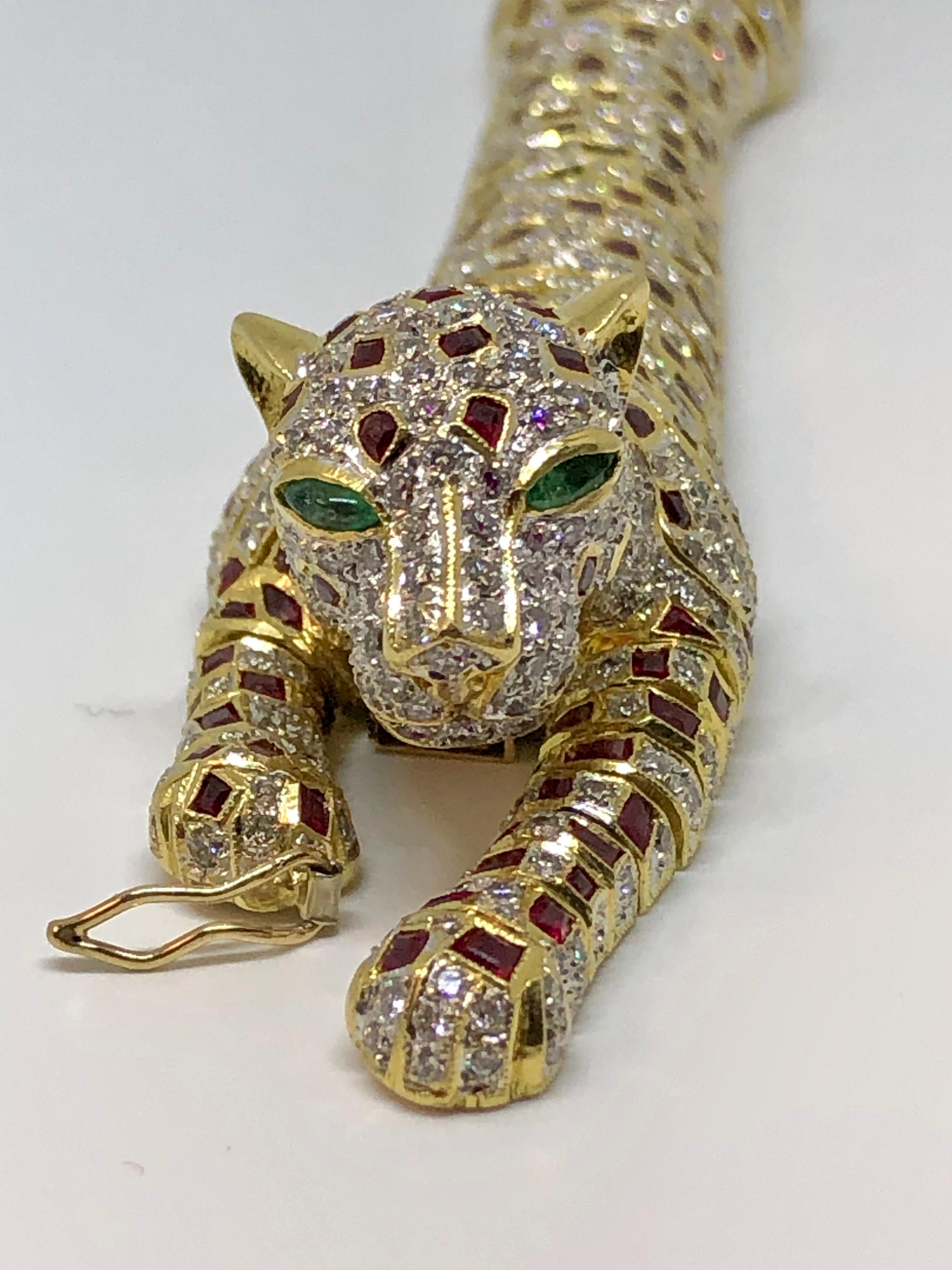 Modern Lady's 18 Karat Yellow Gold Diamond, Ruby and Emerald Panther Bracelet or Brooch