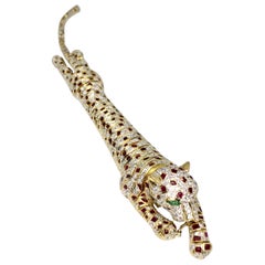 Lady's 18 Karat Yellow Gold Diamond, Ruby and Emerald Panther Bracelet or Brooch