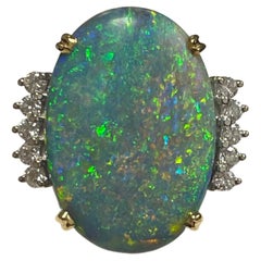 Lady's Black Opal and Diamond Ring in 18k Yellow and White Gold
