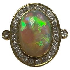 Lady's Black Opal and Diamond Ring in 18k Yellow Gold 