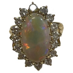 Lady's Black Opal and Diamonds Ring in 18k Yellow Gold