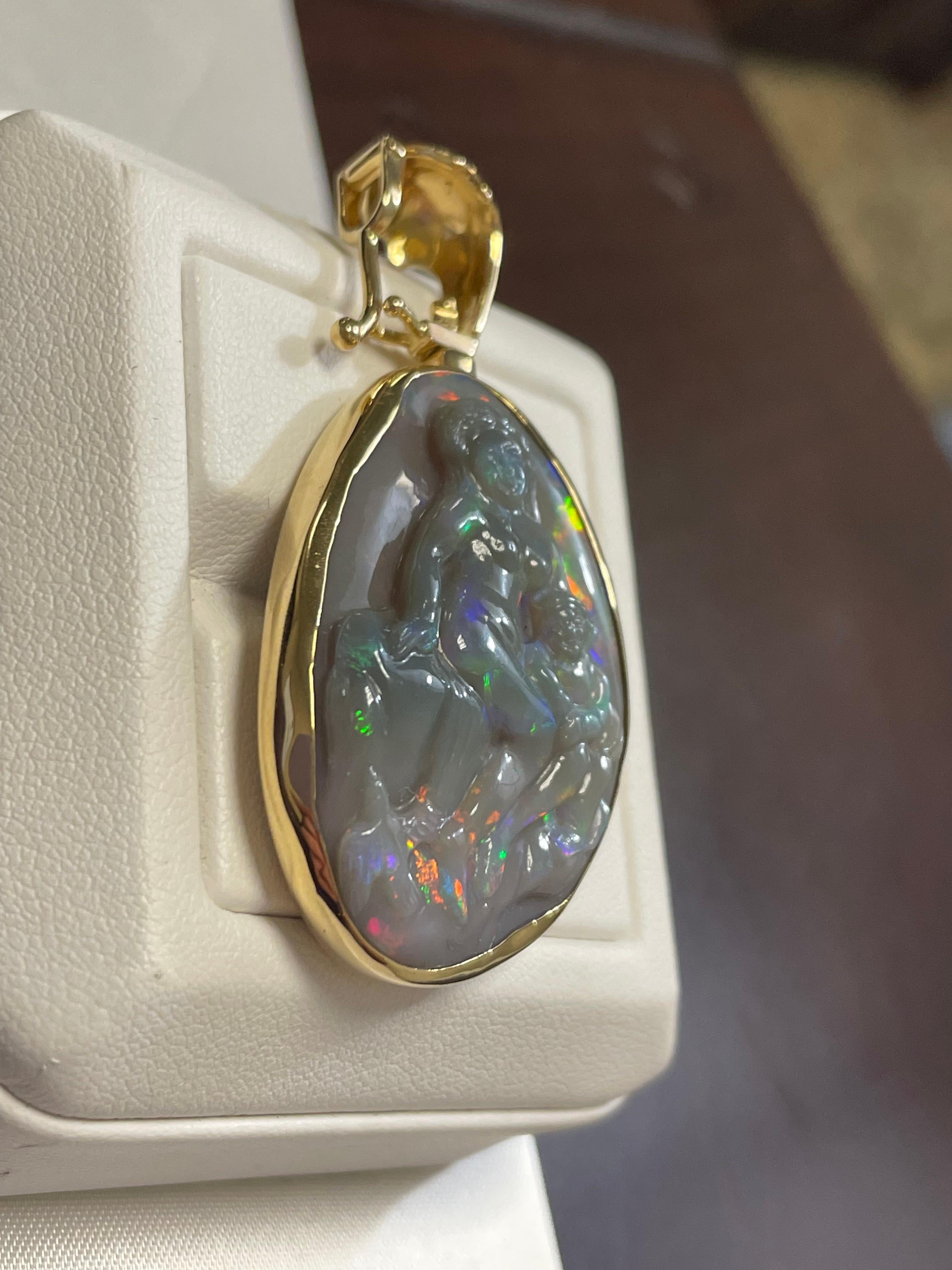 Art Deco Lady's Black Opal Madonna and Child Carving Pendant in 18k Yellow Gold For Sale