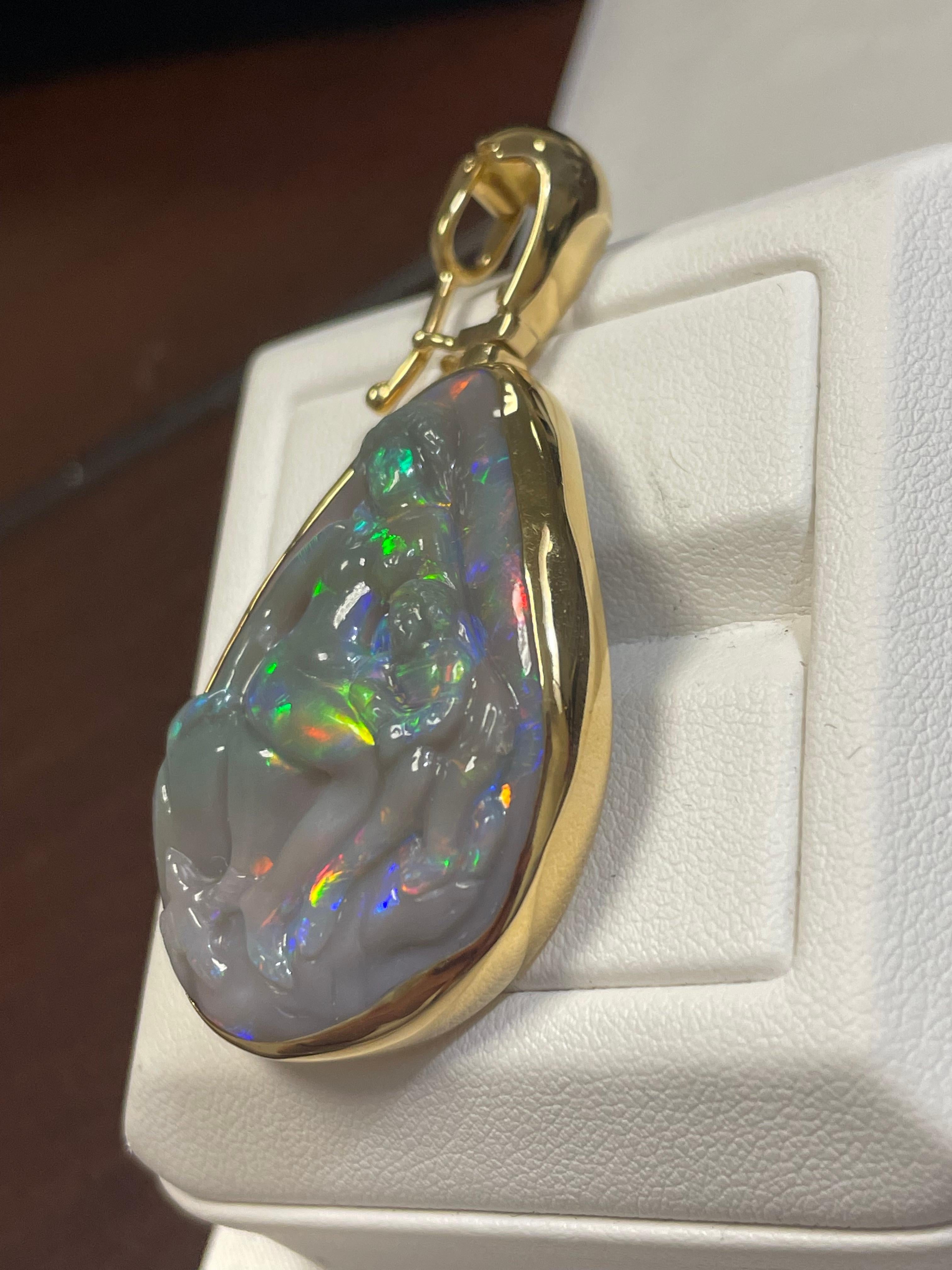Cabochon Lady's Black Opal Madonna and Child Carving Pendant in 18k Yellow Gold For Sale
