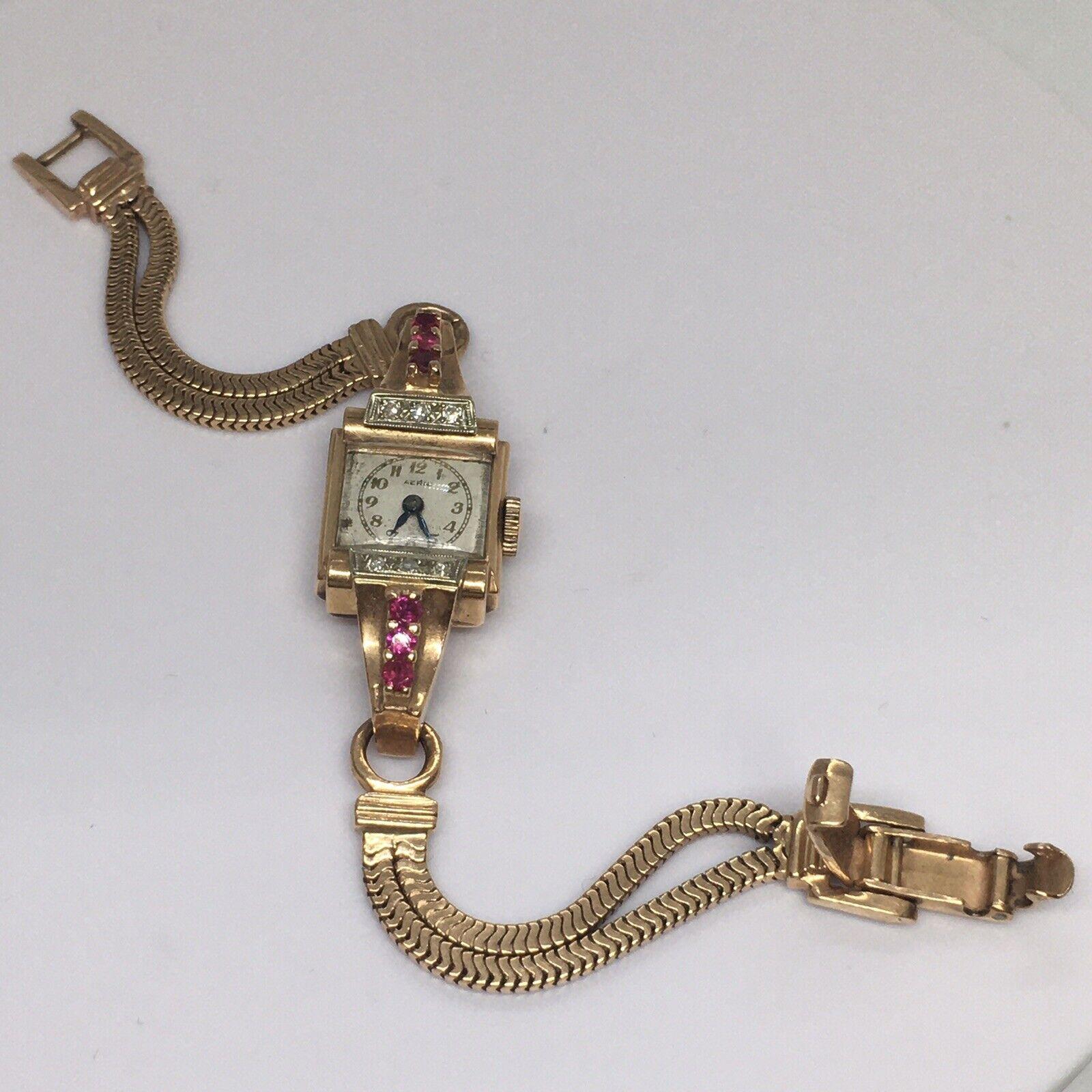 Lady's Charles Areni 14K Rose Gold Mechanical Watch Ruby Diamond Retro 1940s

Wrist Length 6.5 inch
Case 15 mm by 38 mm, 6 round cut Ruby(Not tested) at 2.2 mm, 6 Round Single Cut Diamonds 
Bracelet 7 mm wide
Marking  