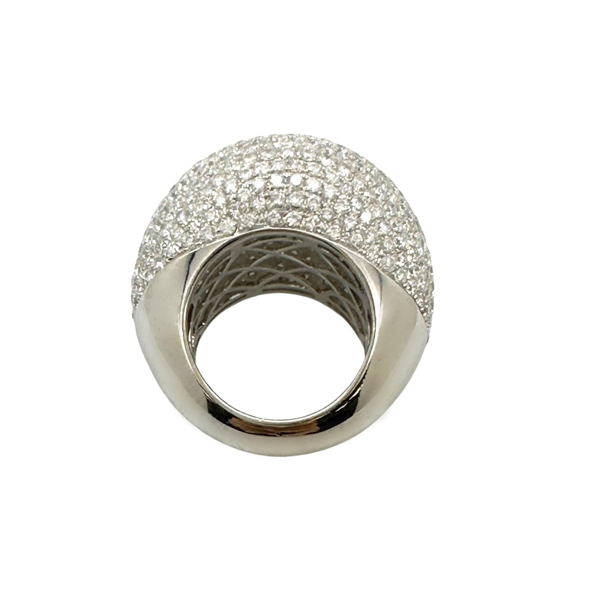 HANA Ladie's Diamond Pave - Set Domed Ring
Style:  Pave
Metal:  18kt White Gold 15.04 grams
Size:  6.5
Measurements:  18.4 - 7.3 MM
TCW:  8.04 tcw
Main Diamond:  409 Round Diamonds 
Color & Clarity:  D - F color, SI1 - SI2 clarity
Comments:  Hollow