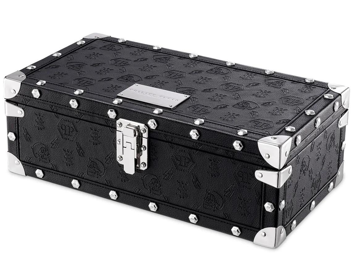 A Very Fine Quality Lady's or Gentleman's Eight Watch Casket modelled as a vintage Suitcase in faux leather with nickel finish mounting and stud detailing, complete with its original lock. Designed by Philipp Plein. 

Beautifully fitted interior to