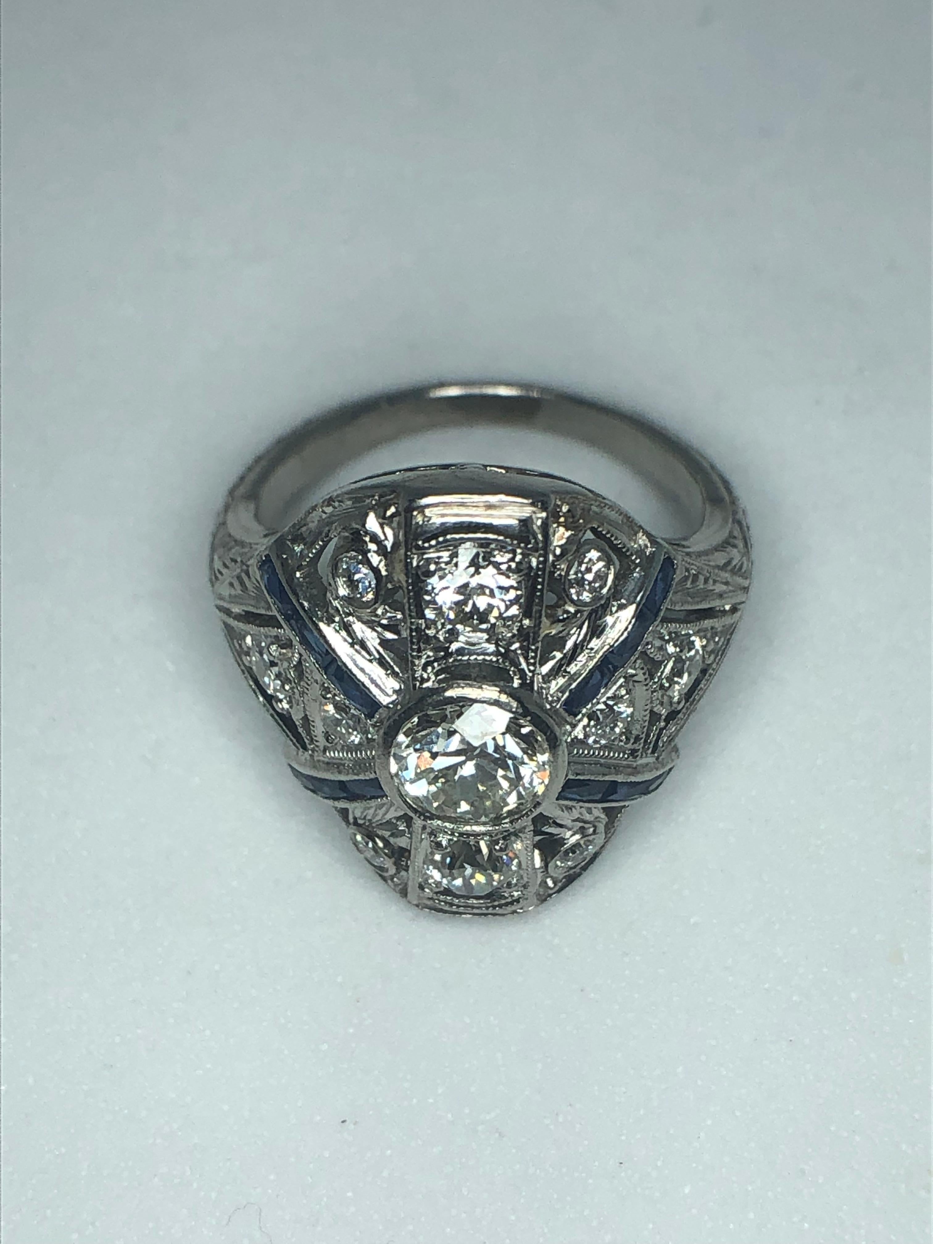 Lady's platinum diamond and sapphire estate ring from the Edwardian to Art Deco era, diamonds = 1.14ct, 1 - European cut round diamond = .64ct color J-L, clarity VVS2-VS1, 10 - European cut round diamonds = .5ct total weight, color G-I, clarity VS2,