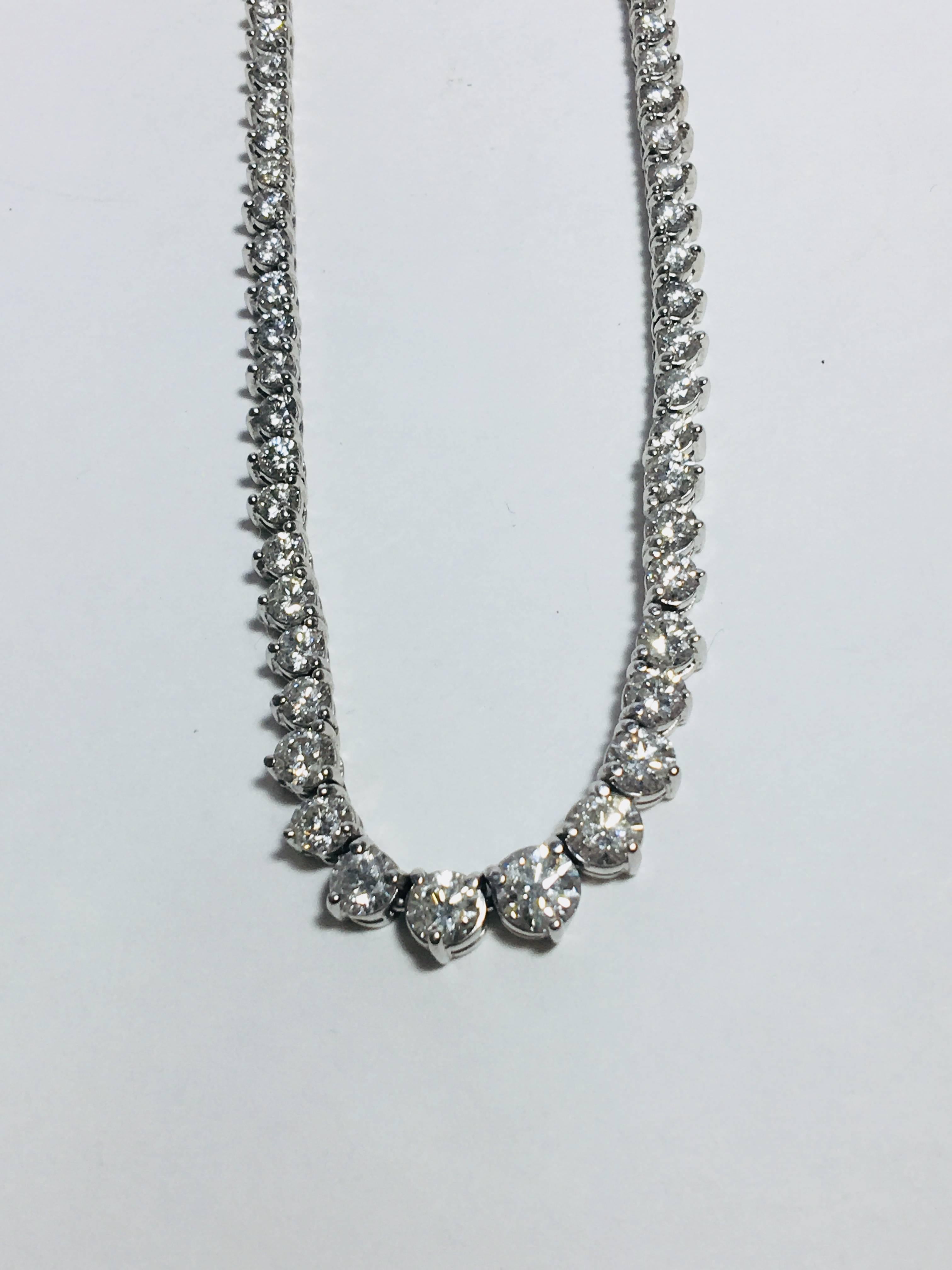 Lady's Diamond Riviera style Necklace containing one hundred fifty thirty five round Brilliant Cut Diamonds. The graduated Sixteen inch long by 5.2 x 2.5 Millimeter Wide Riviera style necklace utilizes 135 three prong set round brilliant cut