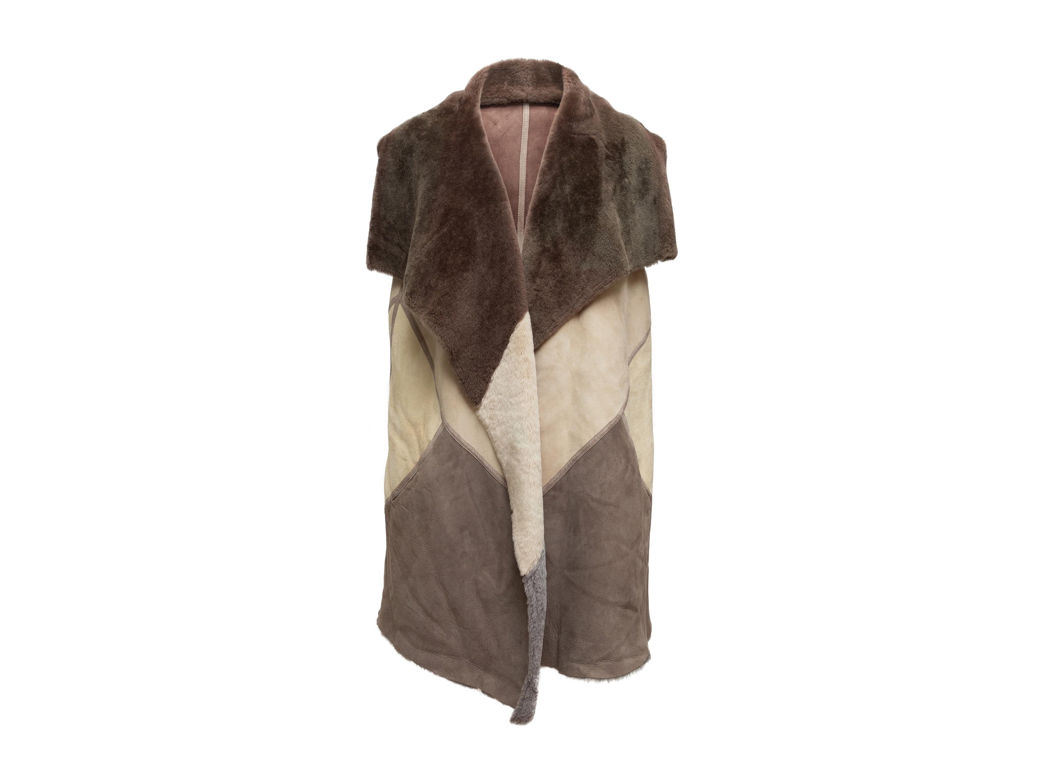 Product details: Brown and beige long shearling color block vest by Lafayette 148. Pointed collar. Open front. 48