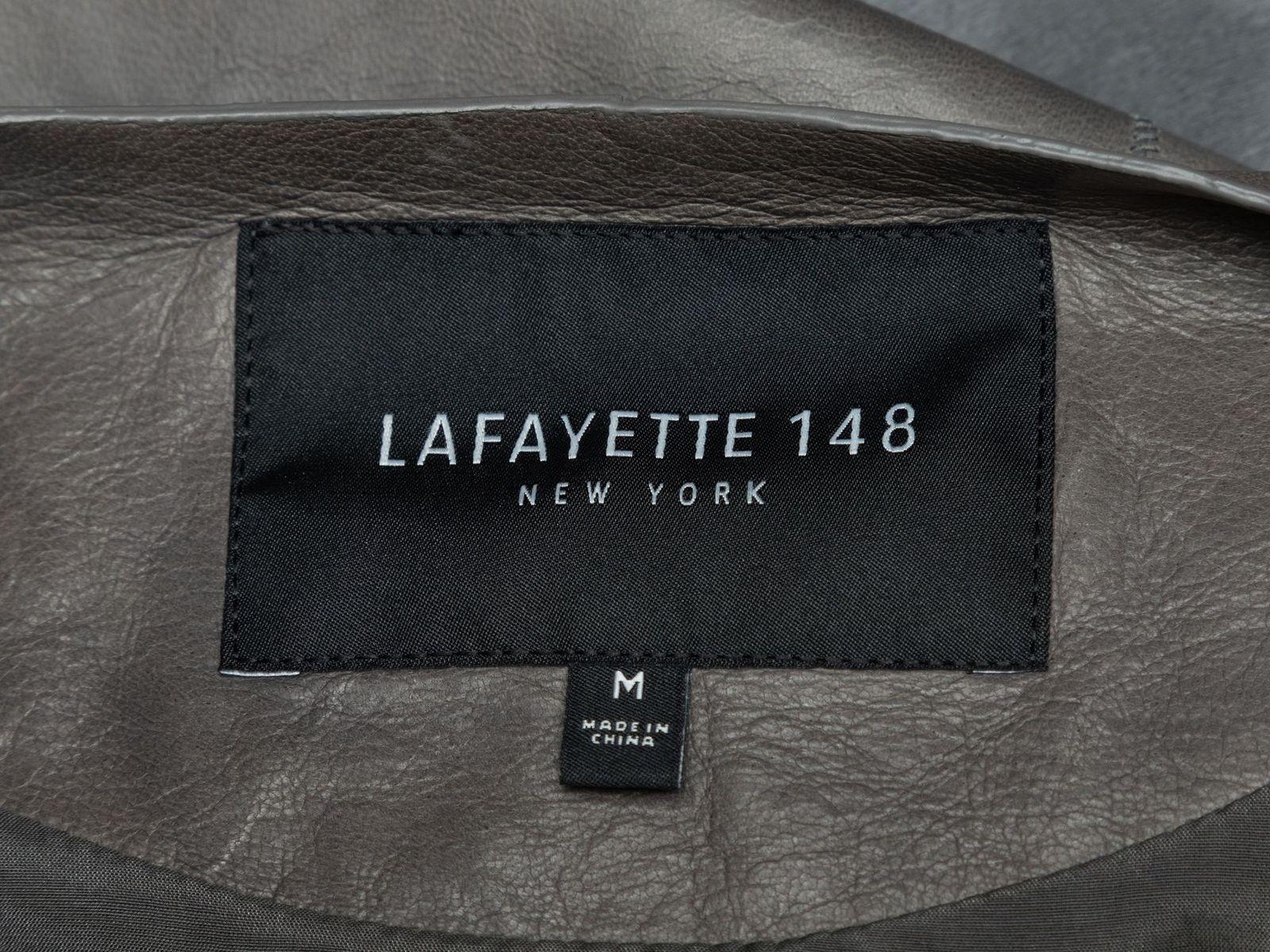 Product Details: Grey and silver leather, ponyhair, and virgin wool patchwork jacket by Lafayette 148. Crew neck. Zip closure at front. 36
