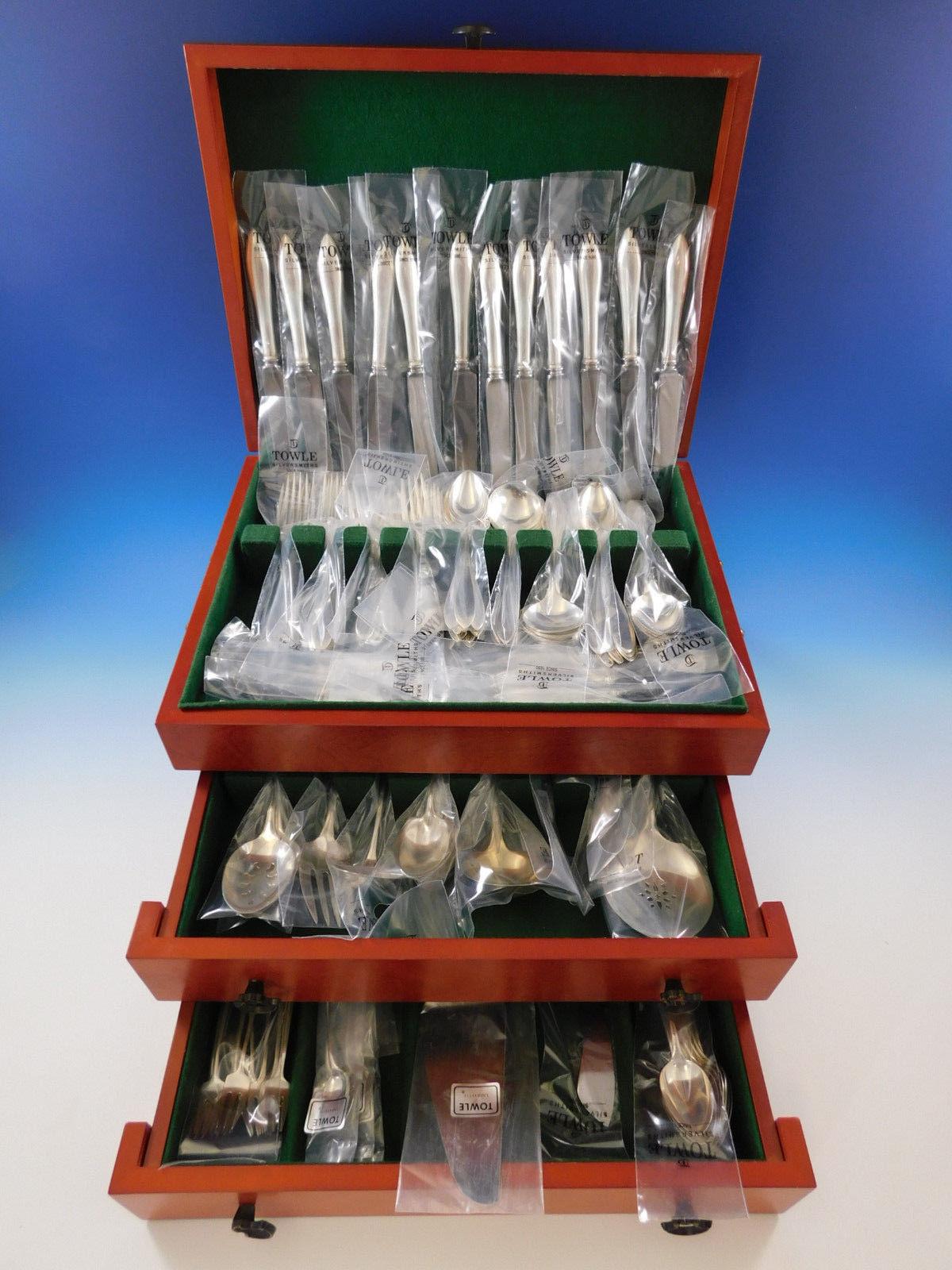 Superb unused Lafayette by Towle sterling silver flatware set, 133 pieces. This classic, timeless set includes:

12 knives, 8 7/8