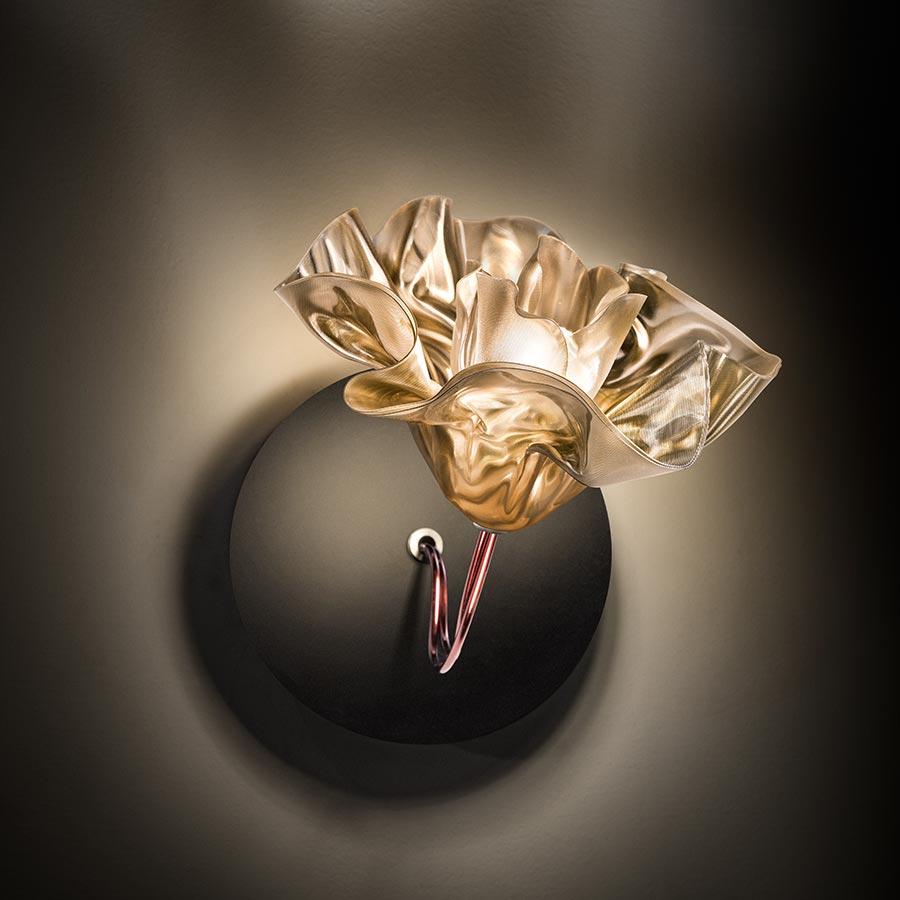 Marc Sadler manually sculpted Slamp's exclusive, unbreakable technopolymer Lentiflex at a controlled temperature to create an illuminated bloom. The LaFleur applique is available in Prisma or Velvet finishes, respectively with matte white or black