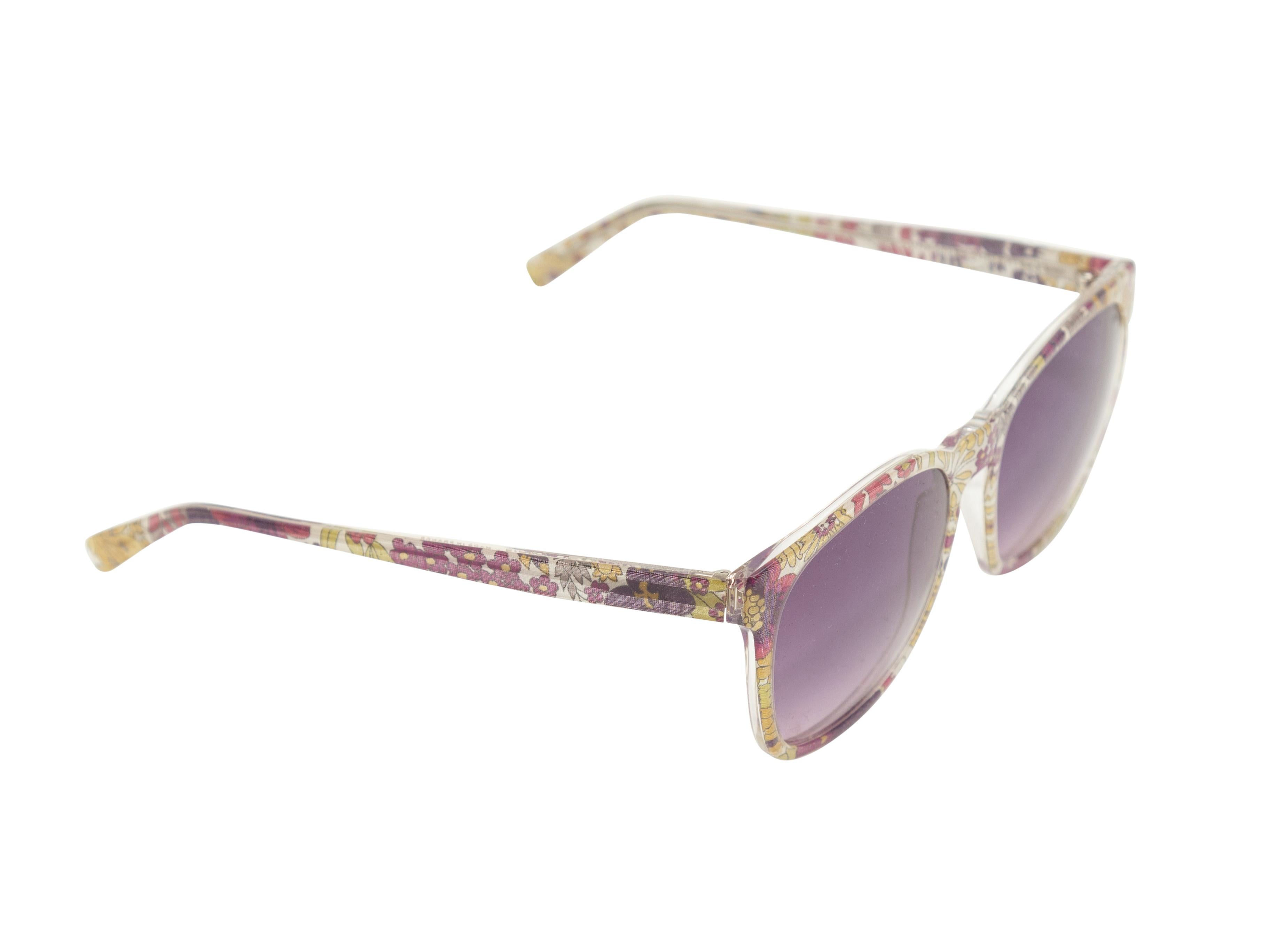 Product details: Purple, yellow, and white floral print sunglasses by Lafont. Purple tinted lenses. 2