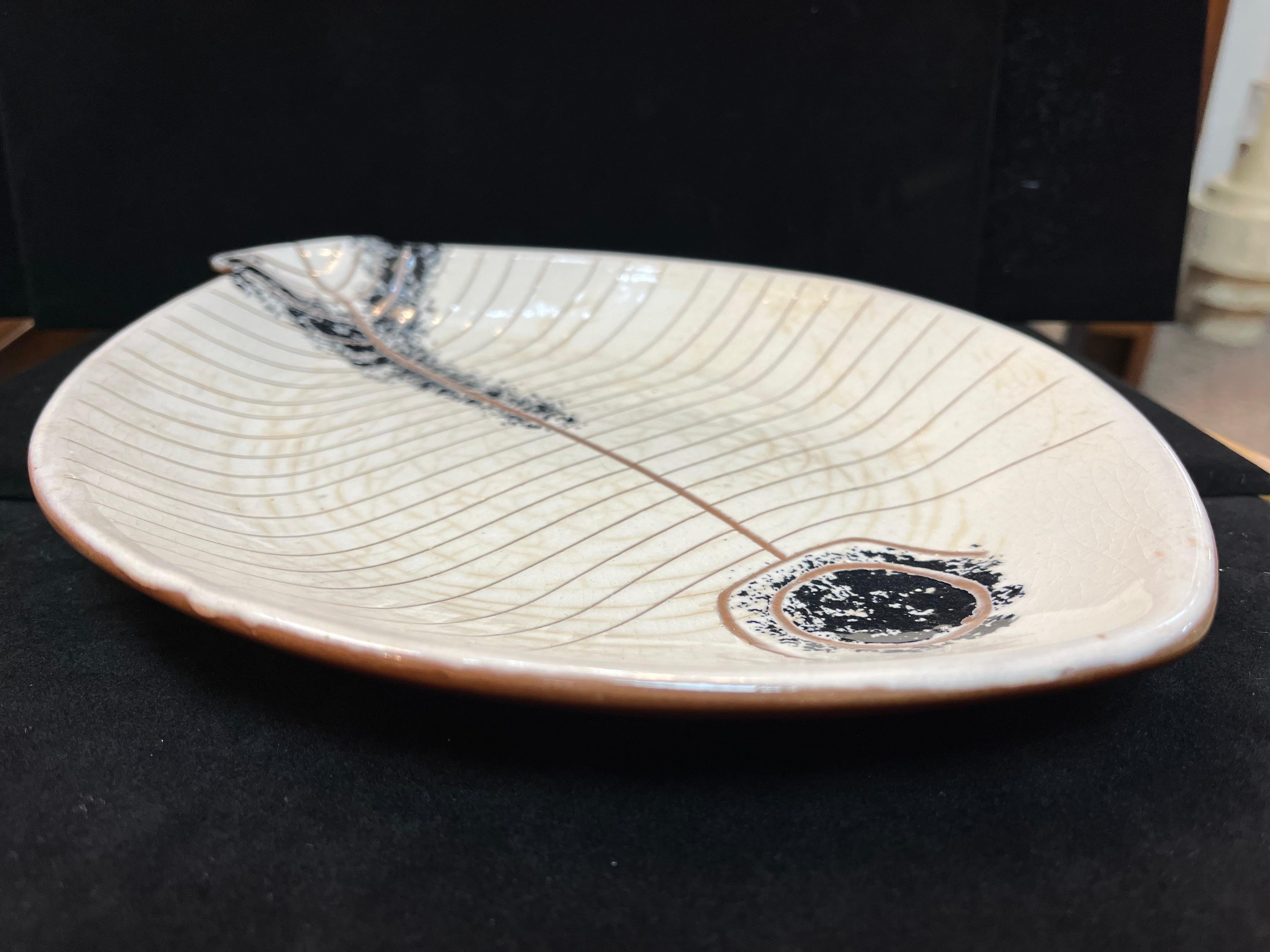 A LaGardo Tackett and Ken Fujita glazed ceramic mid century modern fish plate sculpture. LaGardo Tackett was a founding designer for Architectural Pottery in Los Angleles. From the British Museum, 