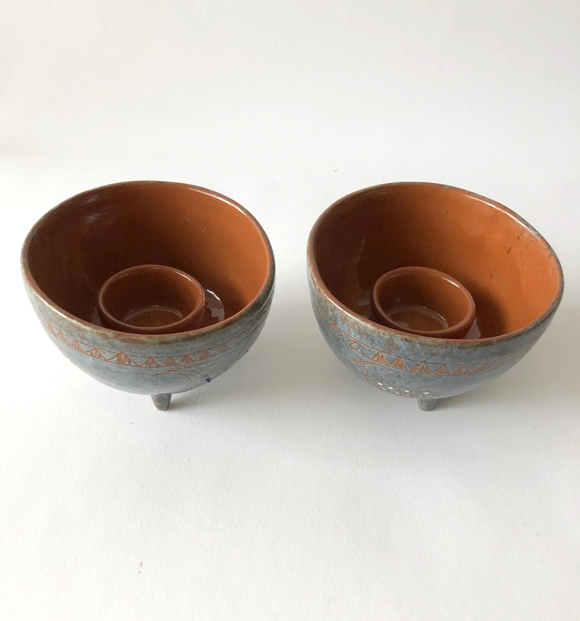 Pair of candleholders with drawn hieroglyphic design created by LaGardo Tackett. Candleholders measure 3 1/4