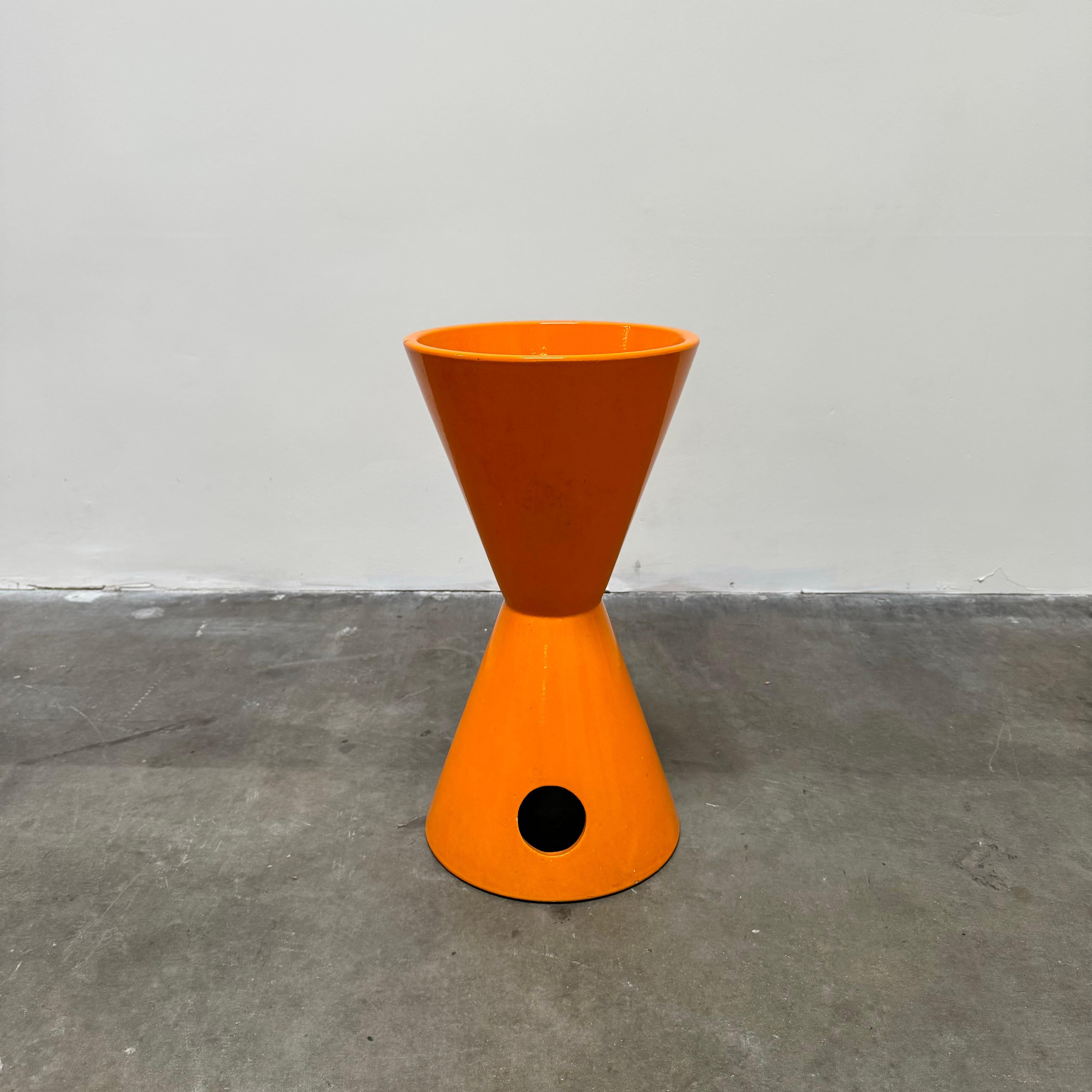Double-Cone planter designed by LaGardo Tackett for Architectural Pottery, USA 1950's.

Quintessential modernist planter with rarely-seen double-sided circular cutout. Glazed stoneware in vibrant orange colour.

Has a wonderful provenance having