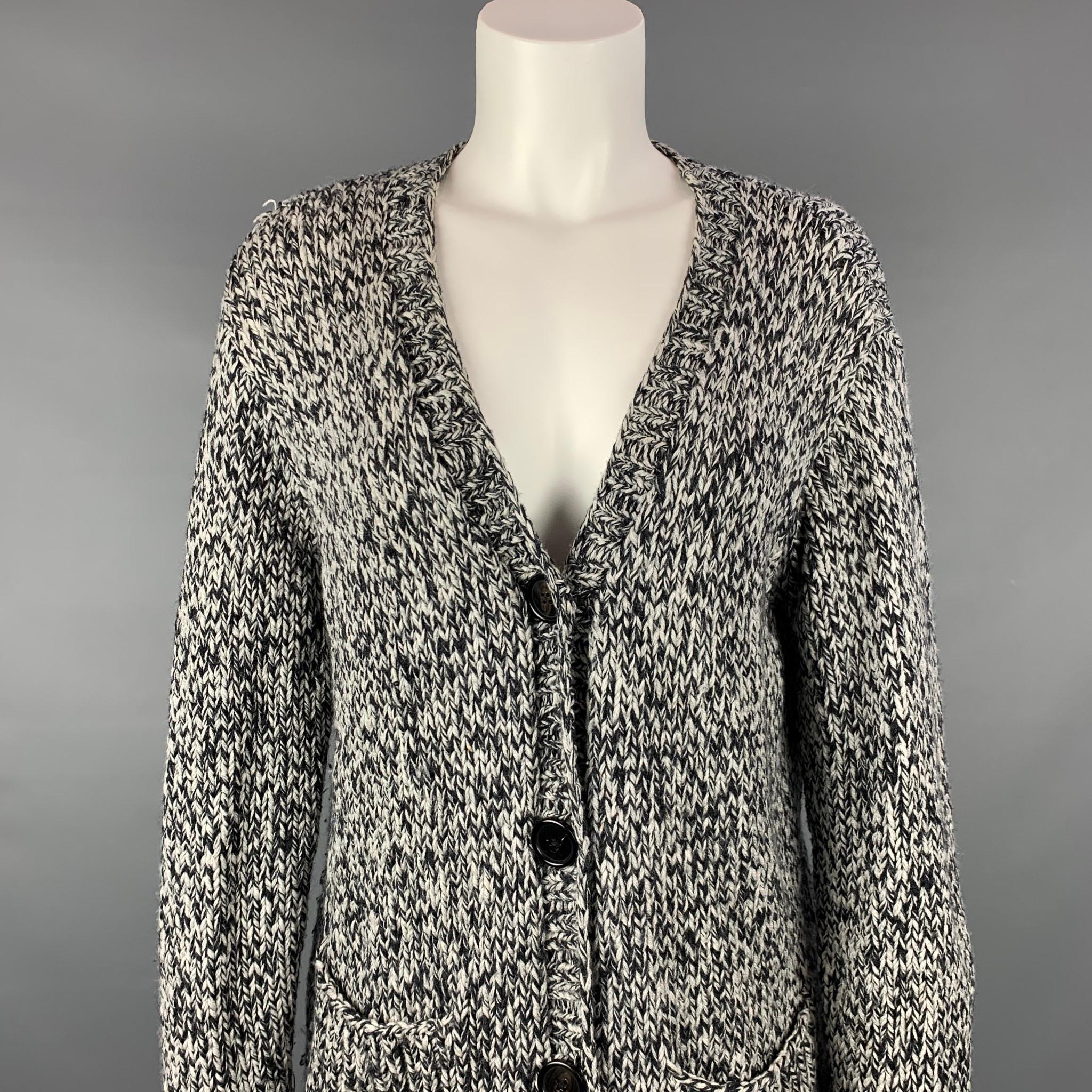 L'AGENCE cardigan comes in a navy & grey knitted merino wool featuring a oversized sit, patch pockets, and a buttoned closure. 

Very Good Pre-Owned Condition.
Marked: 1
Original Retail Price: $620.00

Measurements:

Shoulder: 18.5 in.
Bust: 40